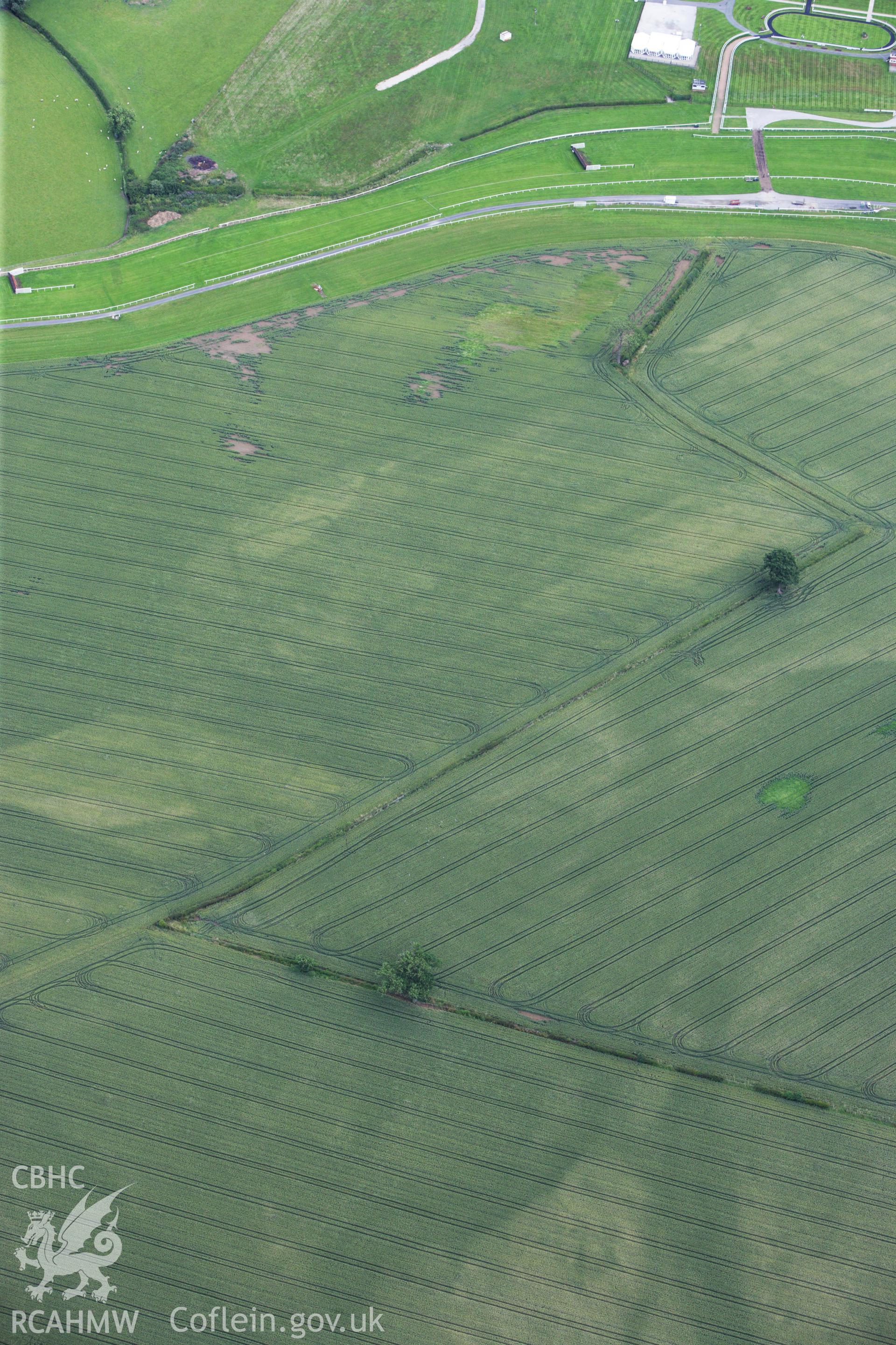 RCAHMW colour oblique aerial photograph of Bangor Race Course Enclosure. Taken on 08 July 2009 by Toby Driver
