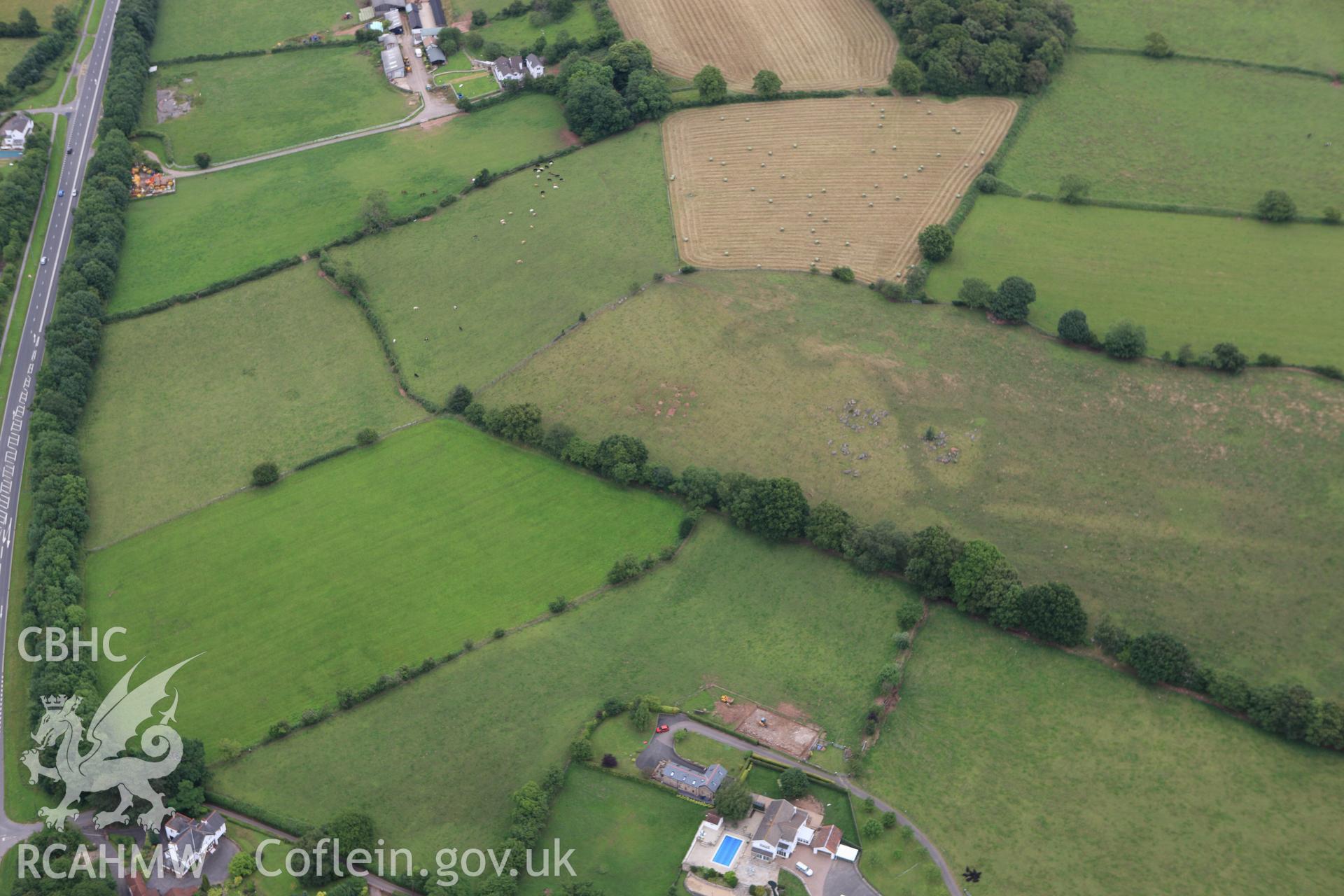 RCAHMW colour oblique aerial photograph of Llandevaud Cropmark Enclosure. Taken on 09 July 2009 by Toby Driver