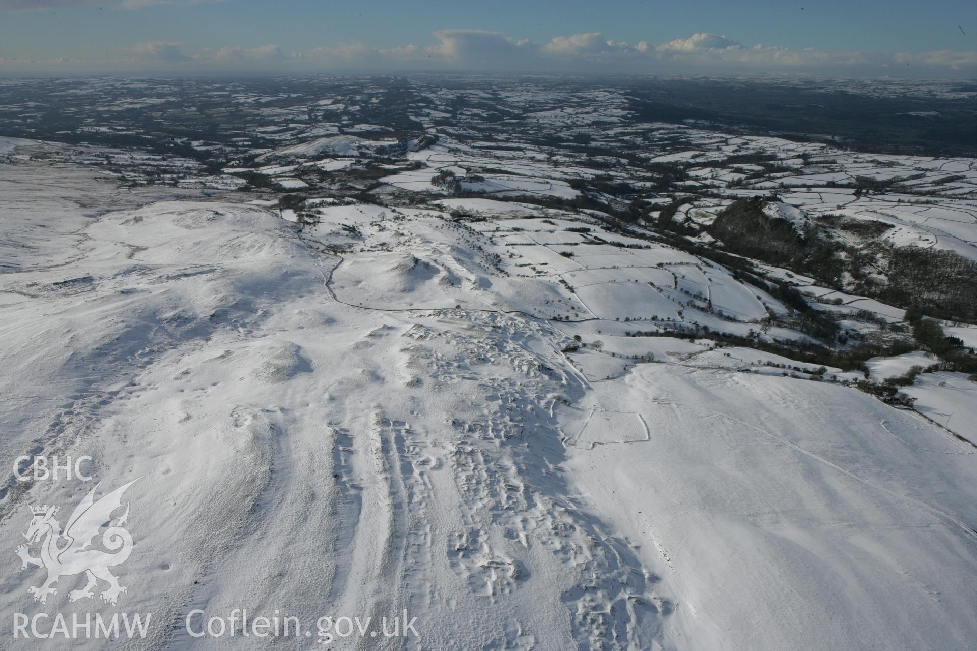 RCAHMW colour oblique photograph of Banc Wernwgan farmstead, wide landscape view. Taken by Toby Driver on 06/02/2009.