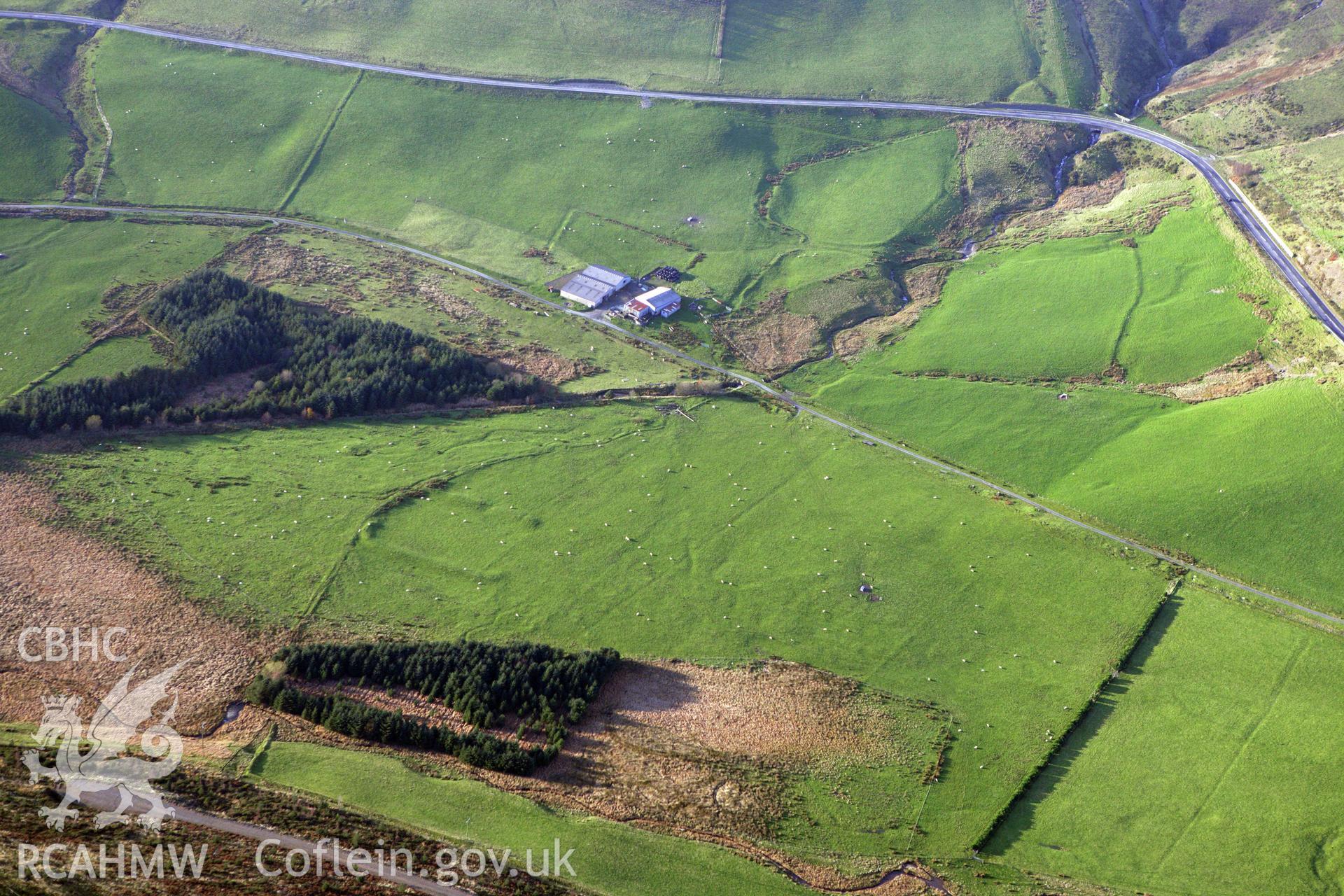 RCAHMW colour oblique aerial photograph of Llys Arthur earthwork. Taken on 09 November 2009 by Toby Driver