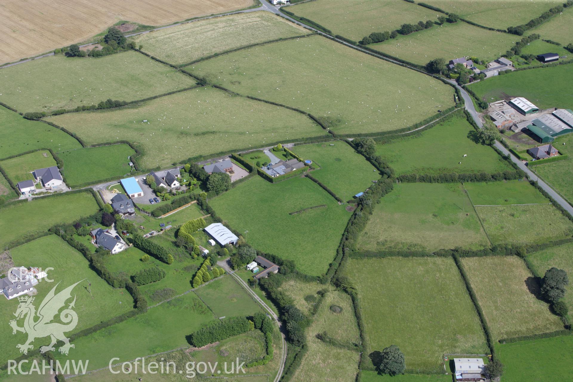 RCAHMW colour oblique aerial photograph of Pen-y-Gorseddau Mound (Axton 'A'). Taken on 30 July 2009 by Toby Driver