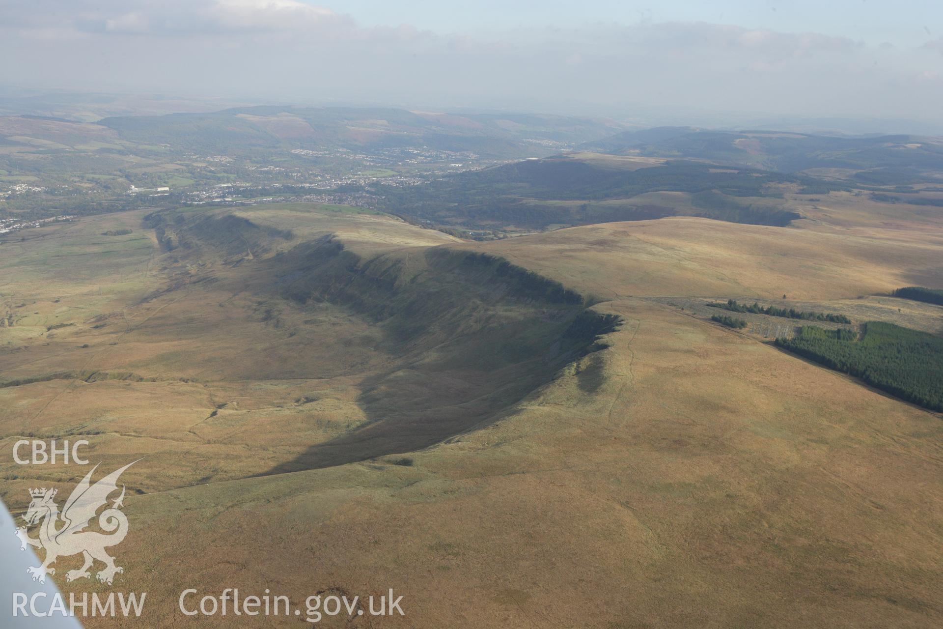 RCAHMW colour oblique aerial photograph of Craig-y-Bwlch Cairn and surrounding landscape looking east. Taken on 14 October 2009 by Toby Driver