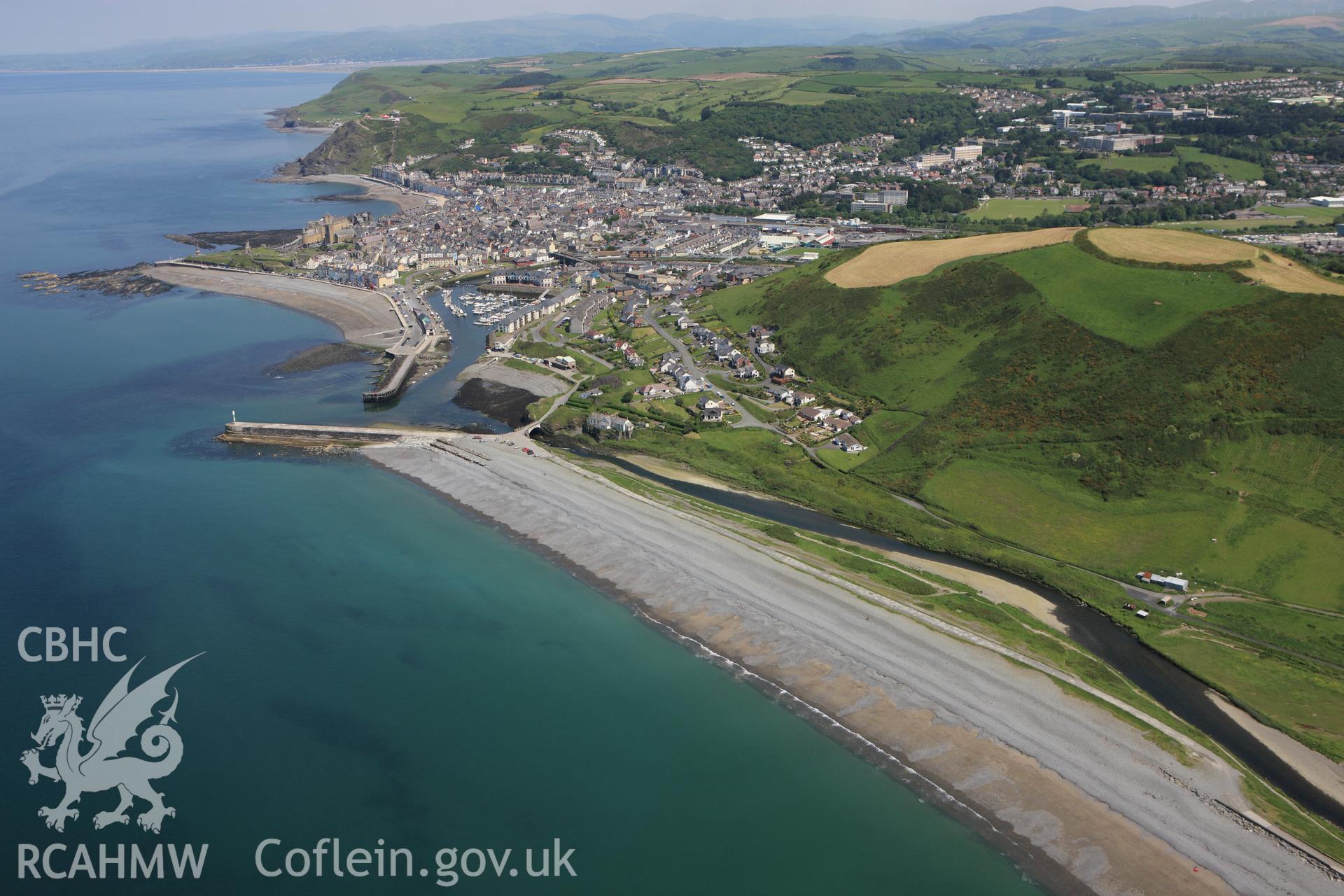 RCAHMW colour oblique aerial photograph of Aberystwyth and surrounding landscape from the south. Taken on 02 June 2009 by Toby Driver