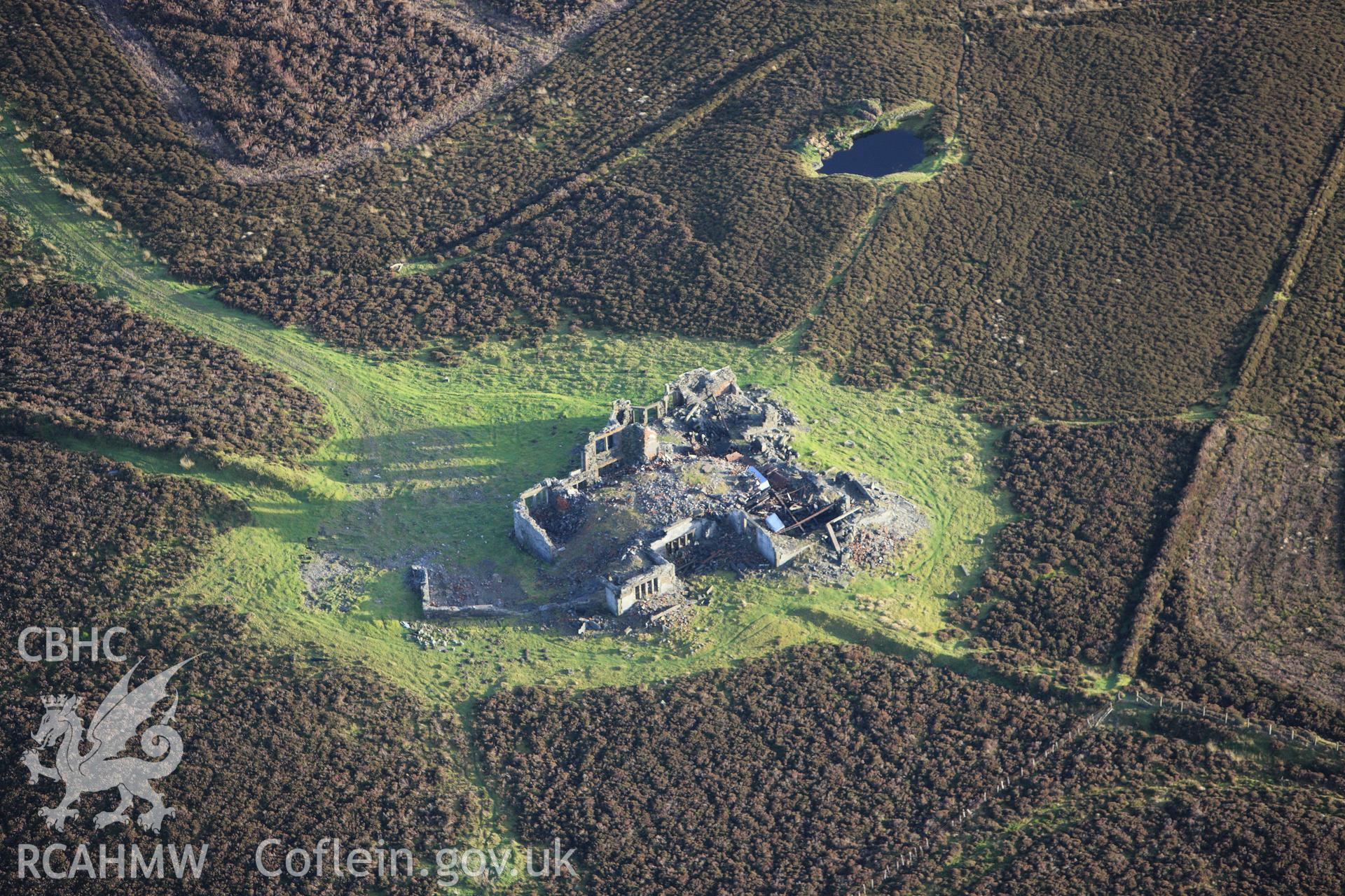 RCAHMW colour oblique aerial photograph of Gwylfa Hiraethog Shooting Lodge, in ruins. Taken on 10 December 2009 by Toby Driver