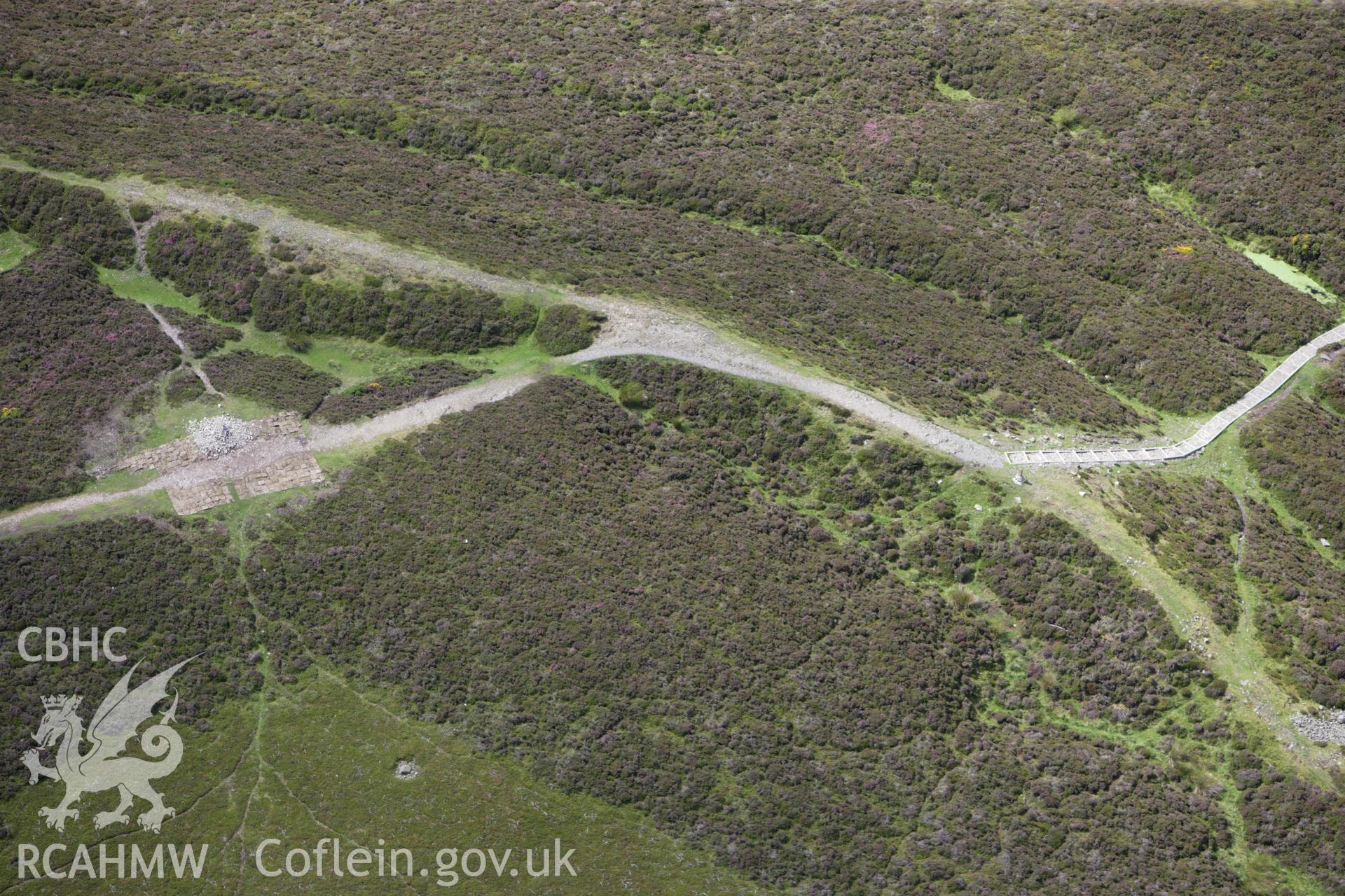RCAHMW colour oblique aerial photograph of Penycloddiau Cairn. Taken on 30 July 2009 by Toby Driver