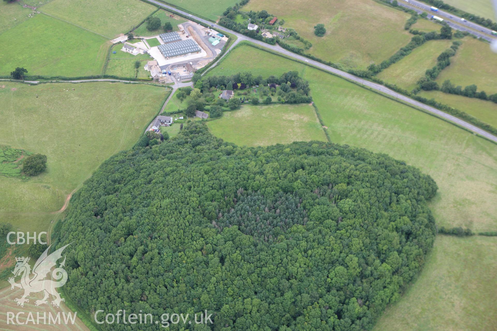 RCAHMW colour oblique aerial photograph of Wilcrick Hill Defended Enclosure. Taken on 09 July 2009 by Toby Driver