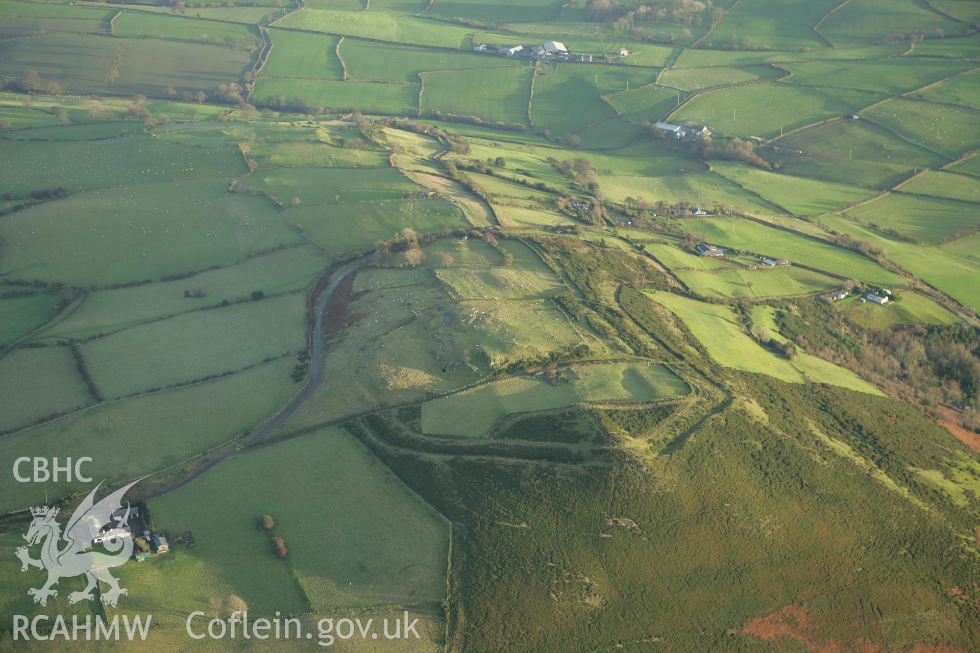 RCAHMW colour oblique aerial photograph of Mynydd y Gaer Hillfort. Taken on 10 December 2009 by Toby Driver