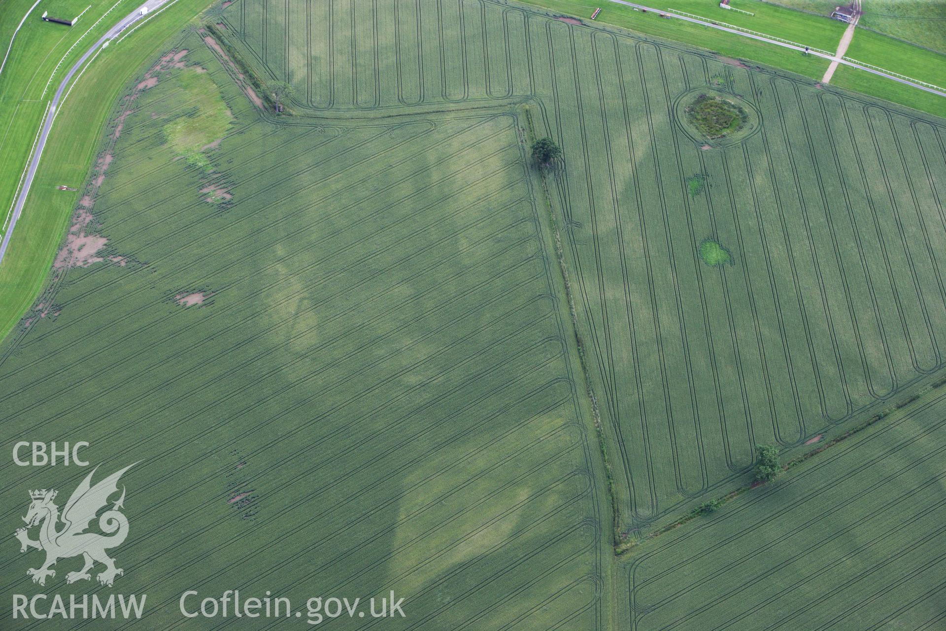 RCAHMW colour oblique aerial photograph of Bangor Race Course Enclosure. Taken on 08 July 2009 by Toby Driver