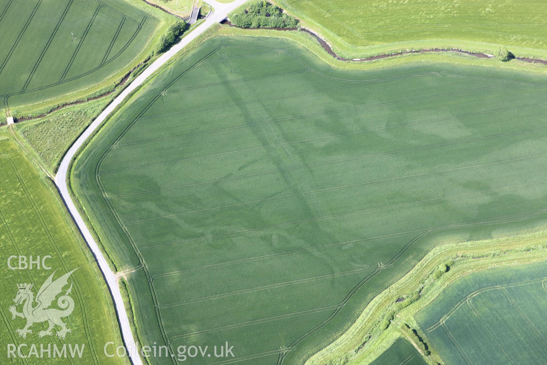 RCAHMW colour oblique aerial photograph of Ditchyeld Bridge Defended Enclosure. Taken on 11 June 2009 by Toby Driver