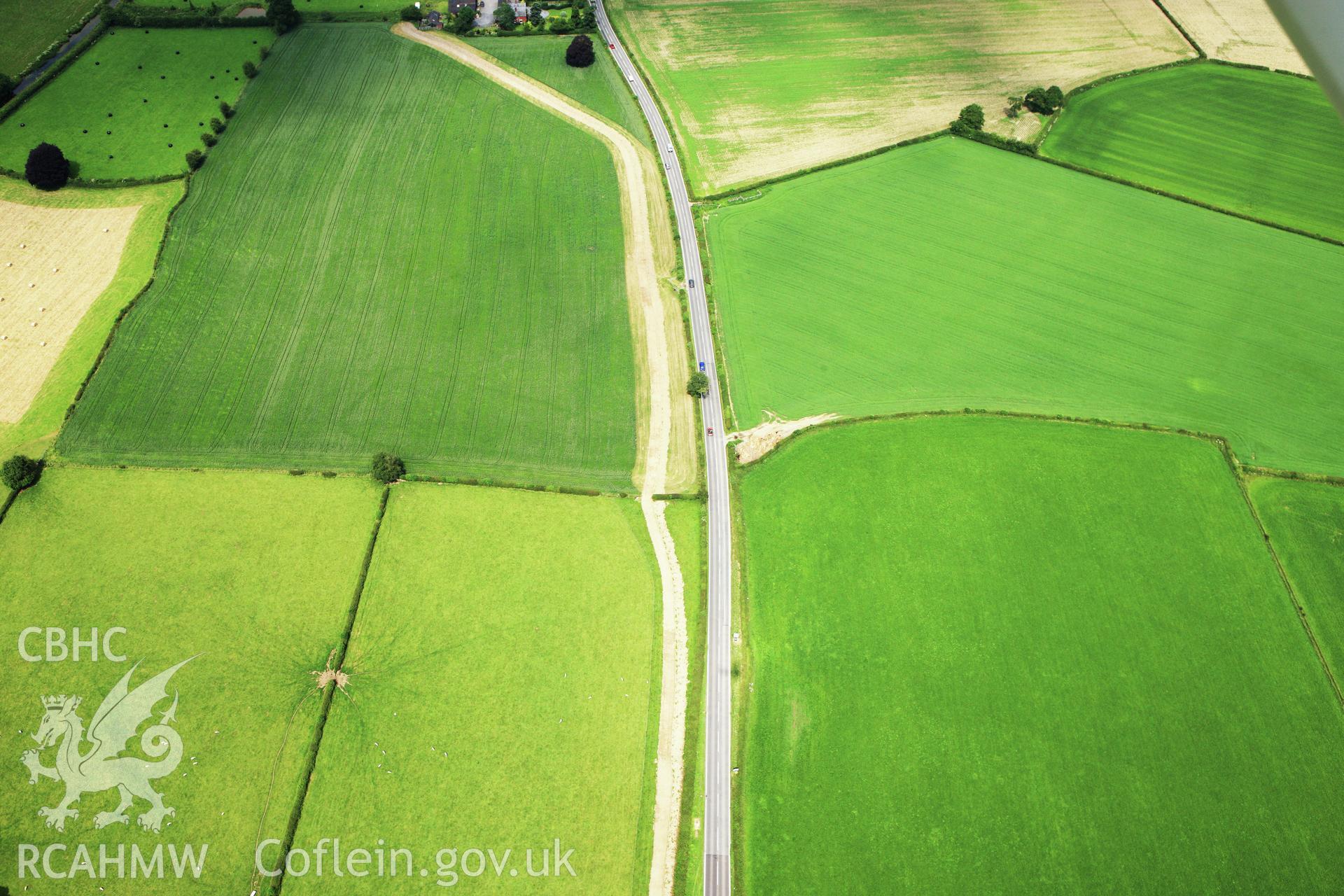 RCAHMW colour oblique aerial photograph of Lower Luggy Cursus, Dyffryn Lane. Taken on 29 June 2009 by Toby Driver