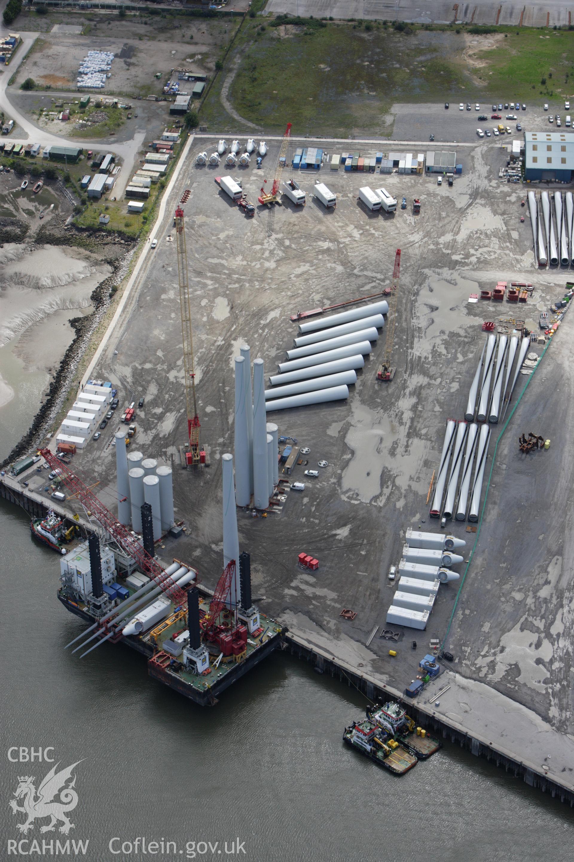 RCAHMW colour oblique aerial photograph of Mostyn Quay, with wind turbines. Taken on 30 July 2009 by Toby Driver