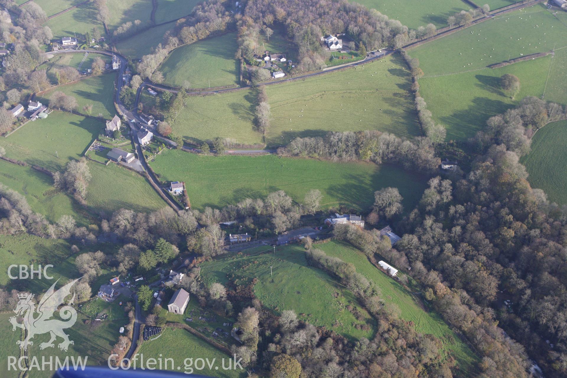 RCAHMW colour oblique aerial photograph of a defended enclosure at Capel Dewi. Taken on 09 November 2009 by Toby Driver