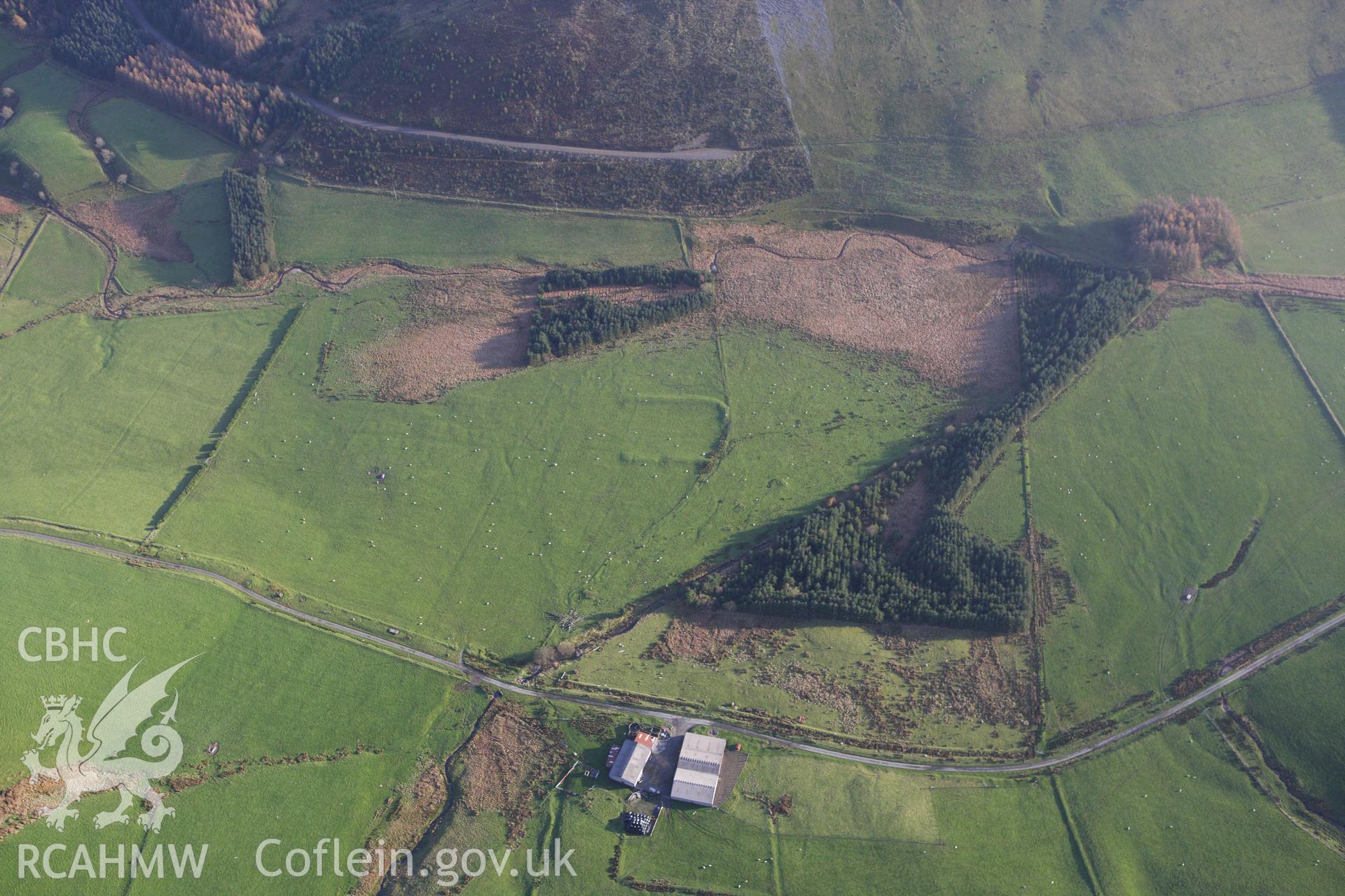 RCAHMW colour oblique aerial photograph of Llys Arthur earthwork. Taken on 09 November 2009 by Toby Driver