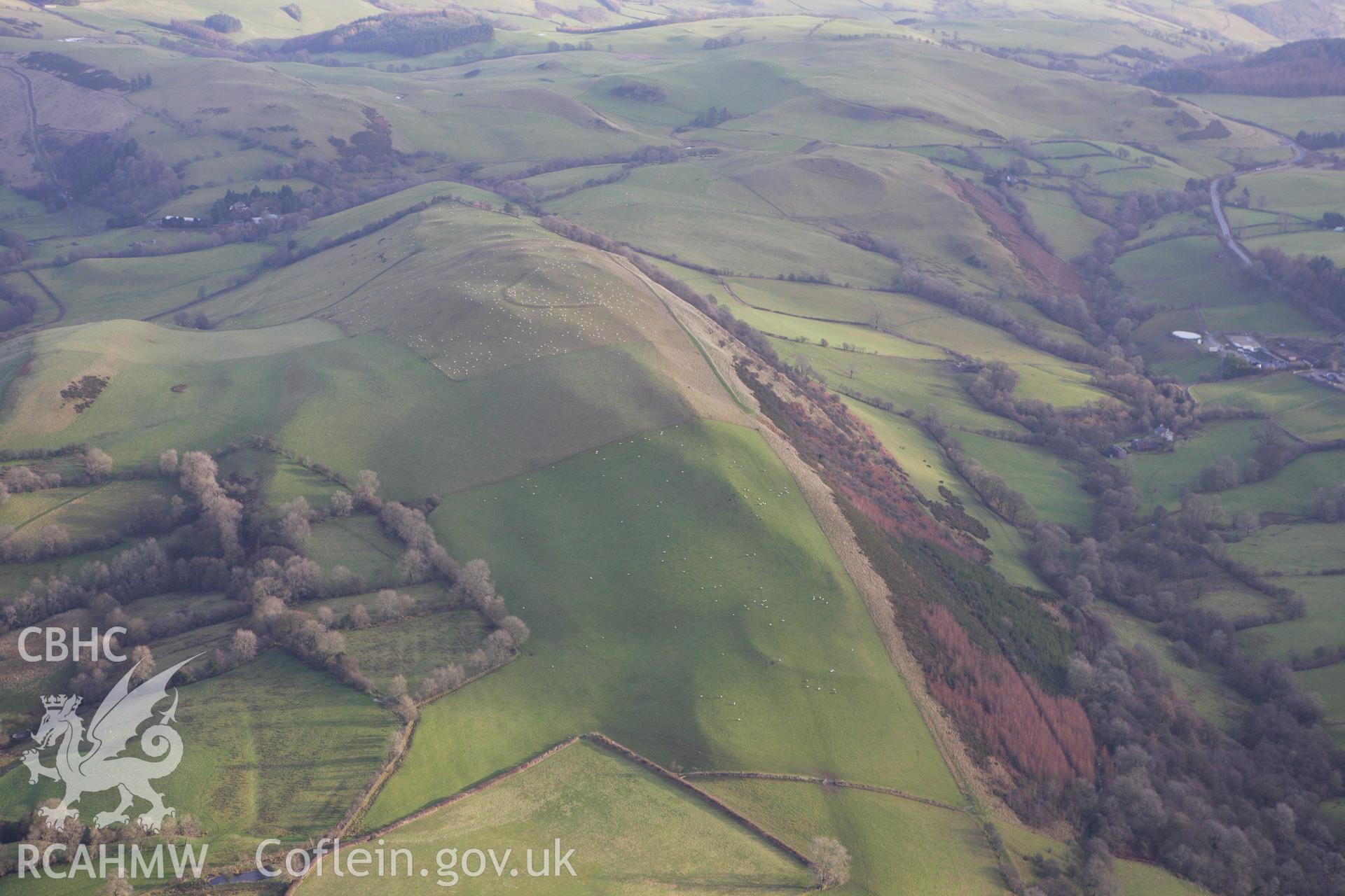 RCAHMW colour oblique aerial photograph of Llyssin Hill Hillfort and Crossdykes. Taken on 10 December 2009 by Toby Driver