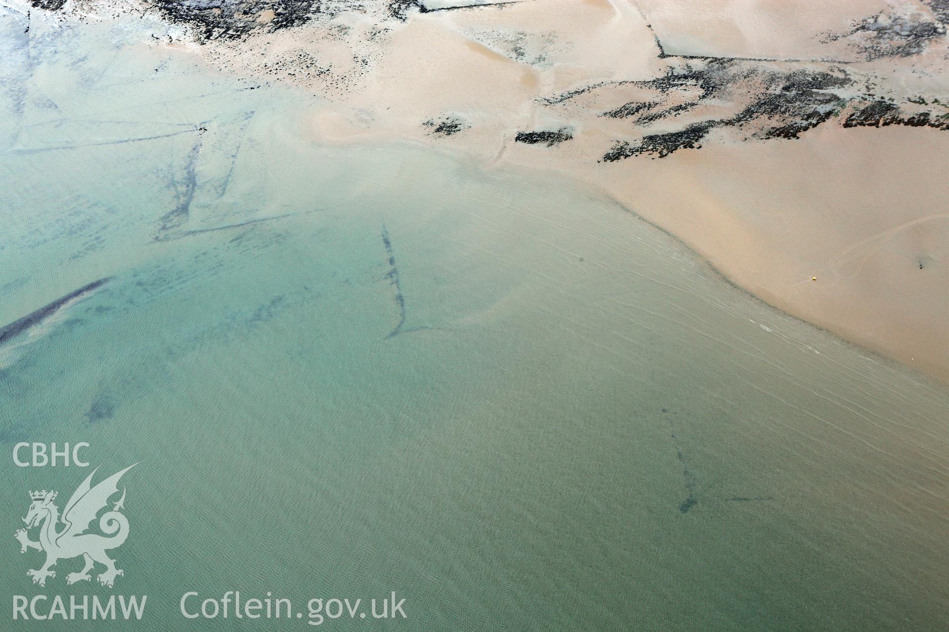 RCAHMW colour oblique aerial photograph of Swansea Bay Fish Traps. Taken on 09 July 2009 by Toby Driver