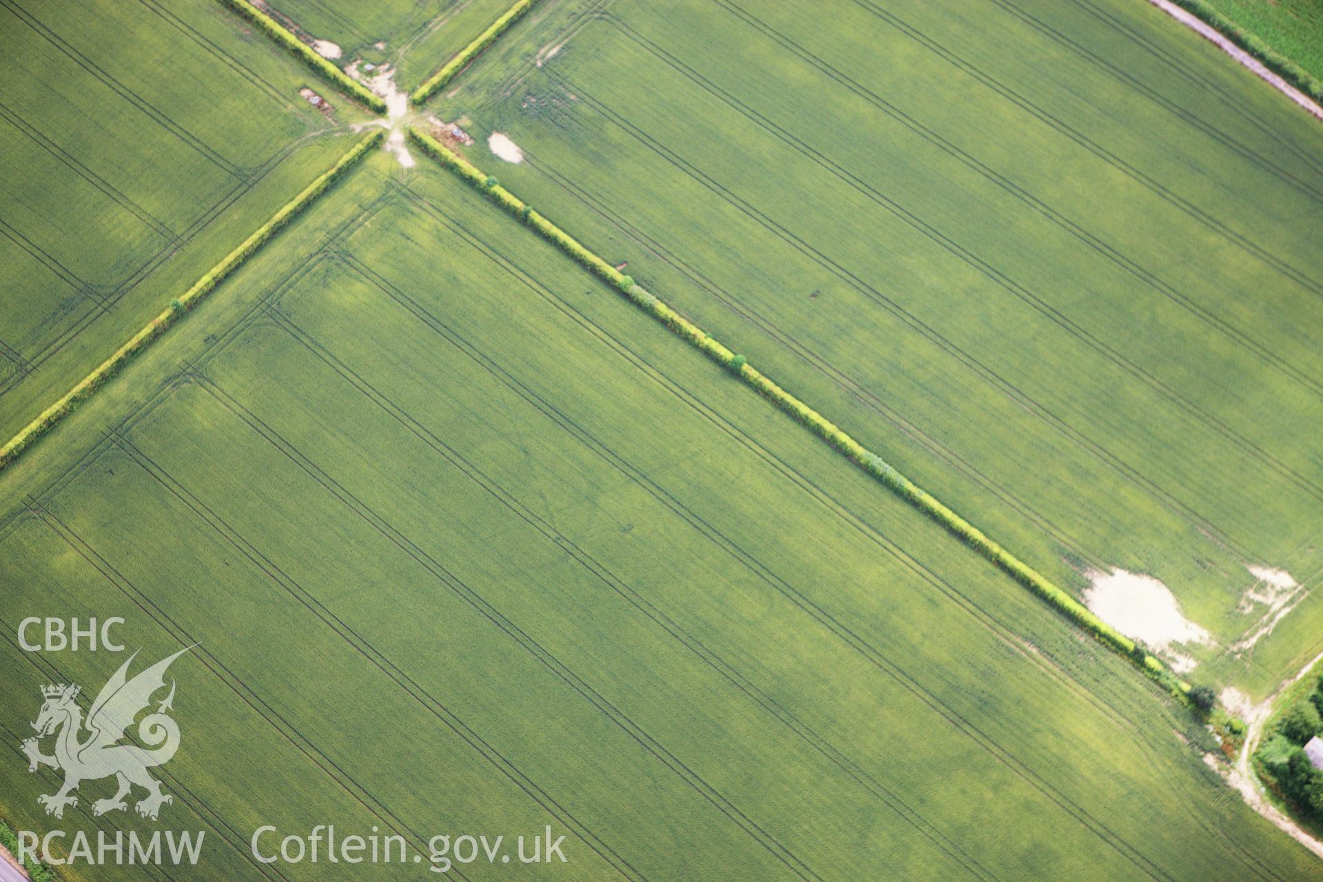 RCAHMW colour oblique aerial photograph of Llancayo Farm Roman Marching Camp. Taken on 09 July 2009 by Toby Driver