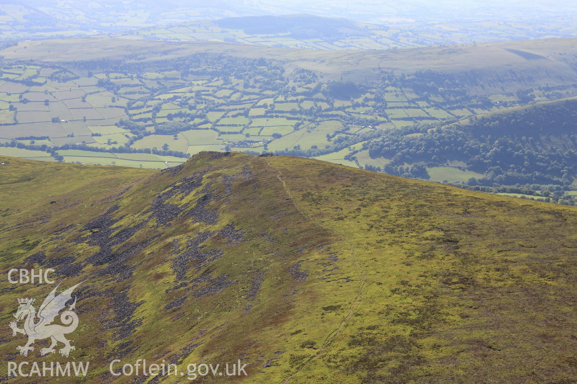RCAHMW colour oblique aerial photograph of Pen Gloch-y-Pibwr Cairn I. Taken on 11 June 2009 by Toby Driver