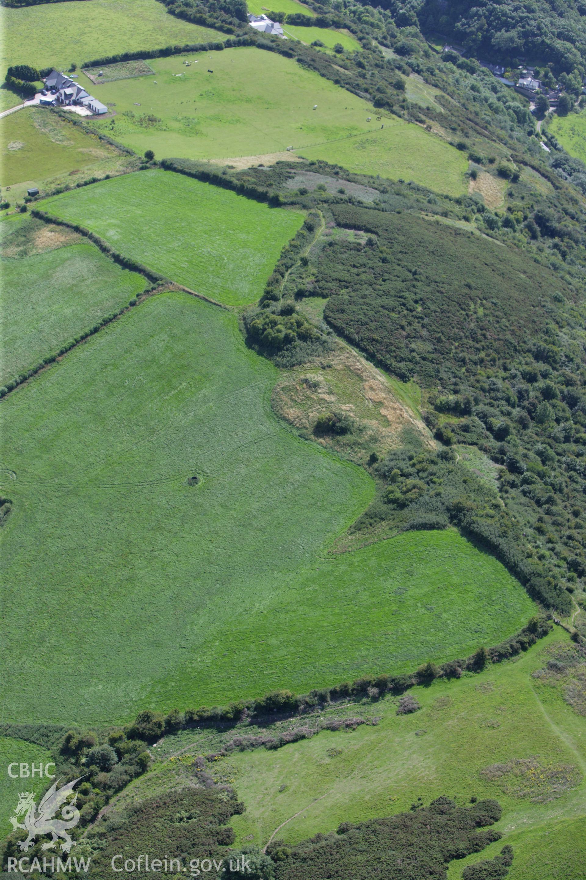 RCAHMW colour oblique aerial photograph of Coed-Yr-Esgob Round Barrow. Taken on 30 July 2009 by Toby Driver