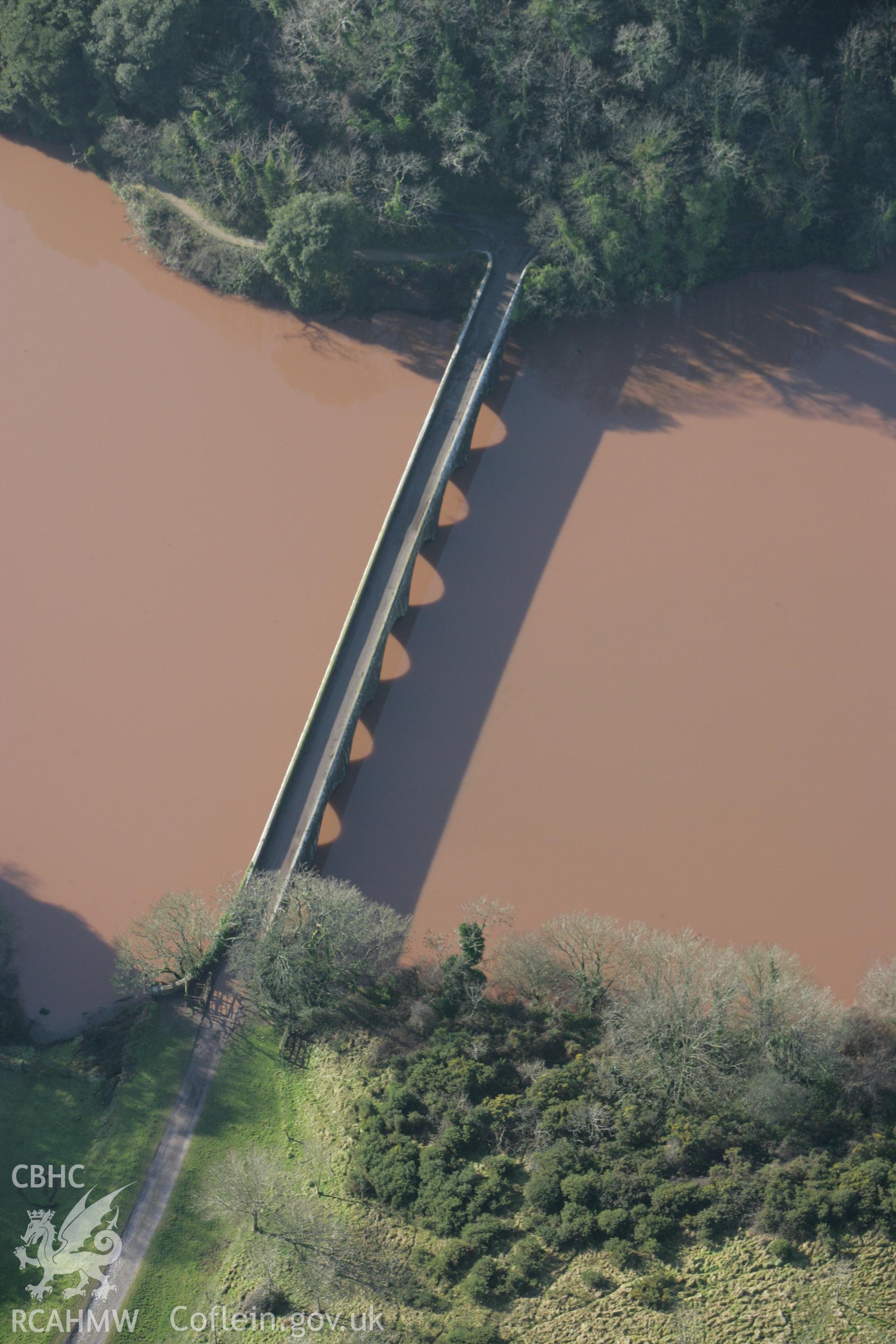 RCAHMW colour oblique aerial photograph of the eight arched Bridge at Stackpole Court. Taken on 28 January 2009 by Toby Driver