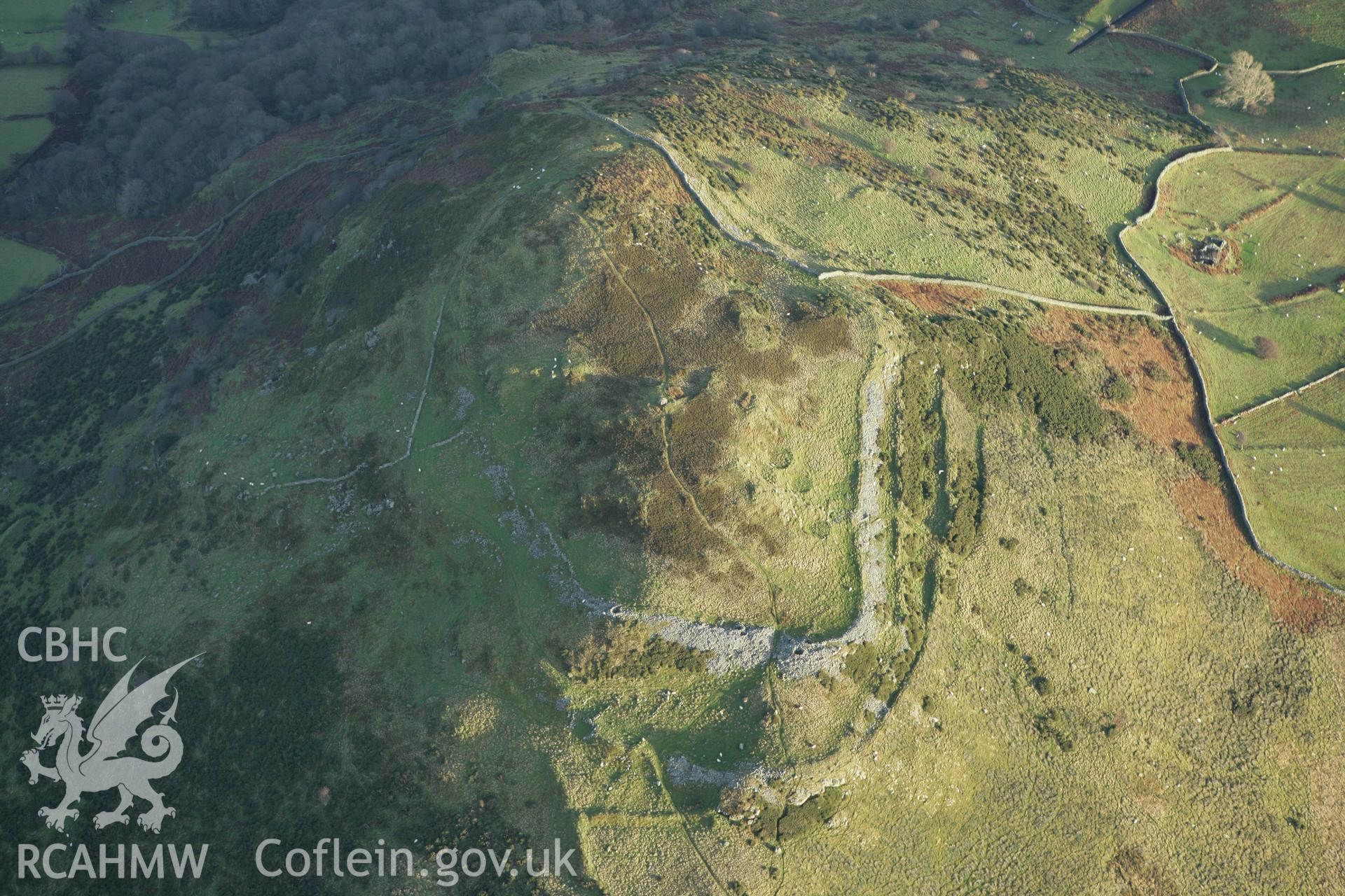 RCAHMW colour oblique aerial photograph of Pen-y-Gaer Hillfort. Taken on 10 December 2009 by Toby Driver