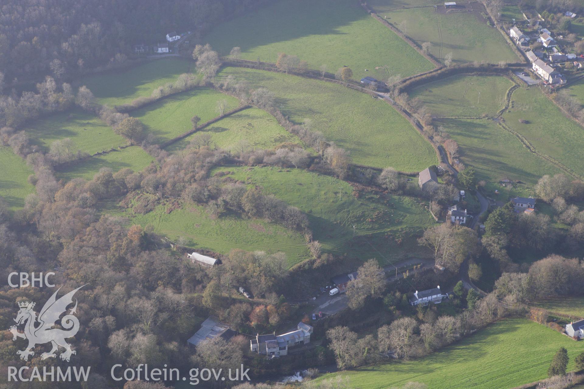 RCAHMW colour oblique aerial photograph of a defended enclosure at Capel Dewi. Taken on 09 November 2009 by Toby Driver