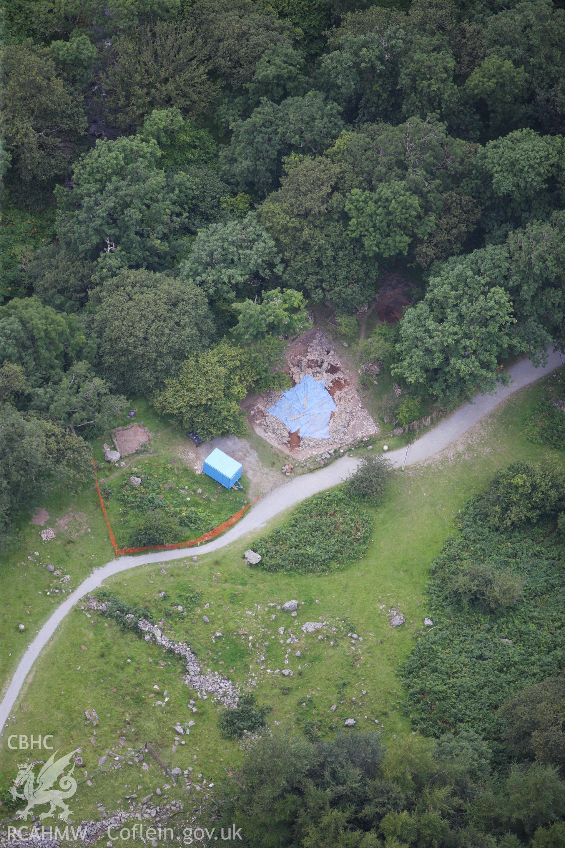 RCAHMW colour oblique aerial photograph of the excavated Hut Circle in Aber Valley. Taken on 06 August 2009 by Toby Driver