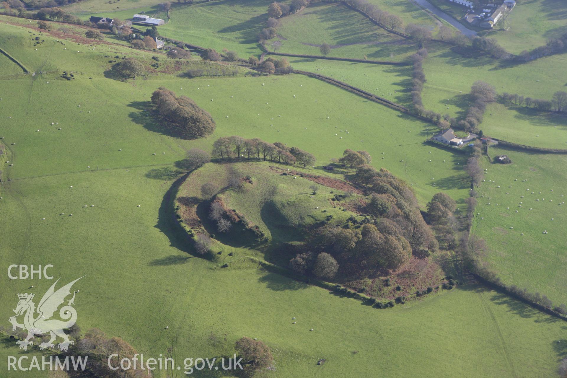 RCAHMW colour oblique aerial photograph of Castell Tregaron (Sunnyhill Wood Camp). Taken on 09 November 2009 by Toby Driver