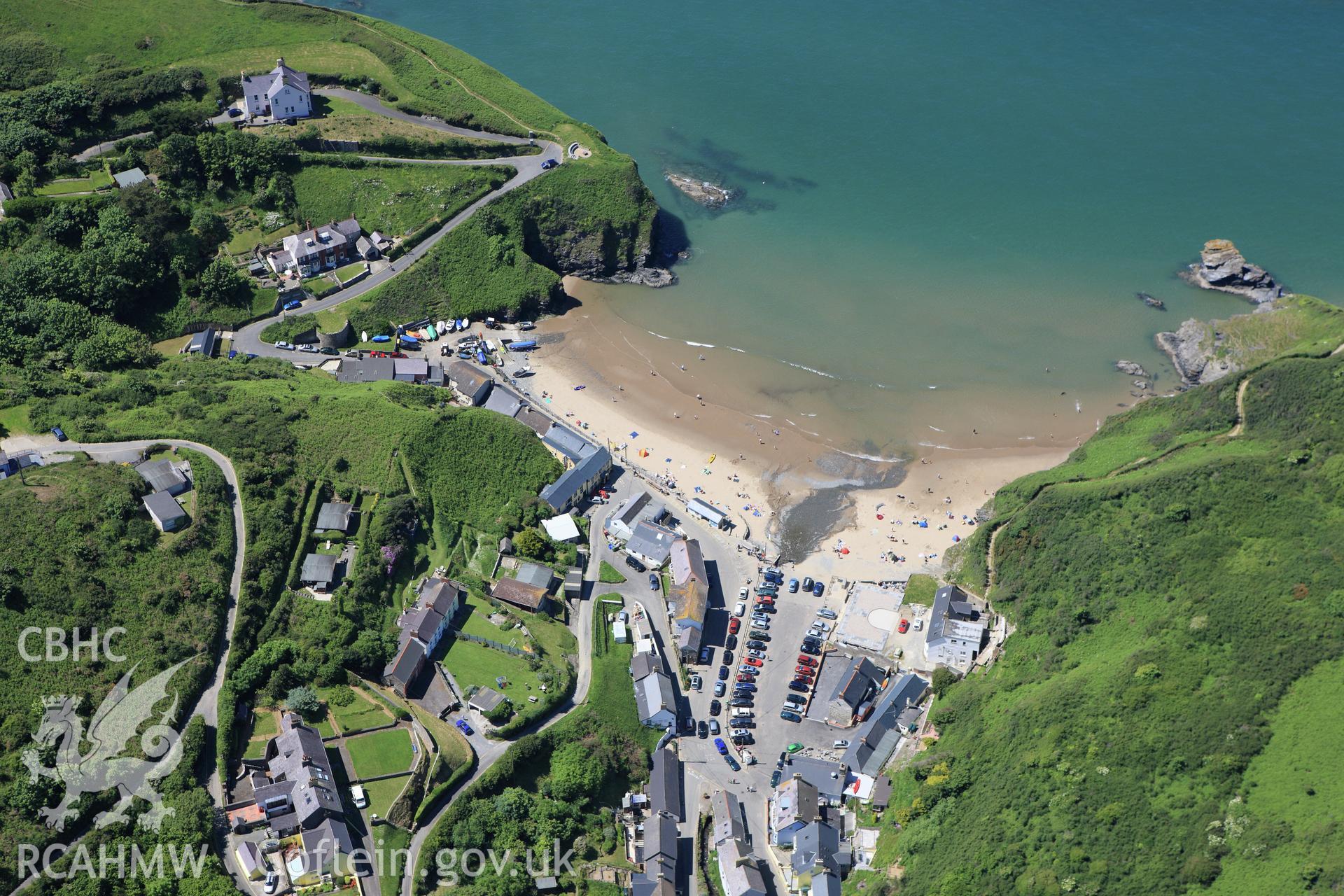 RCAHMW colour oblique aerial photograph of Llangrannog. Taken on 01 June 2009 by Toby Driver