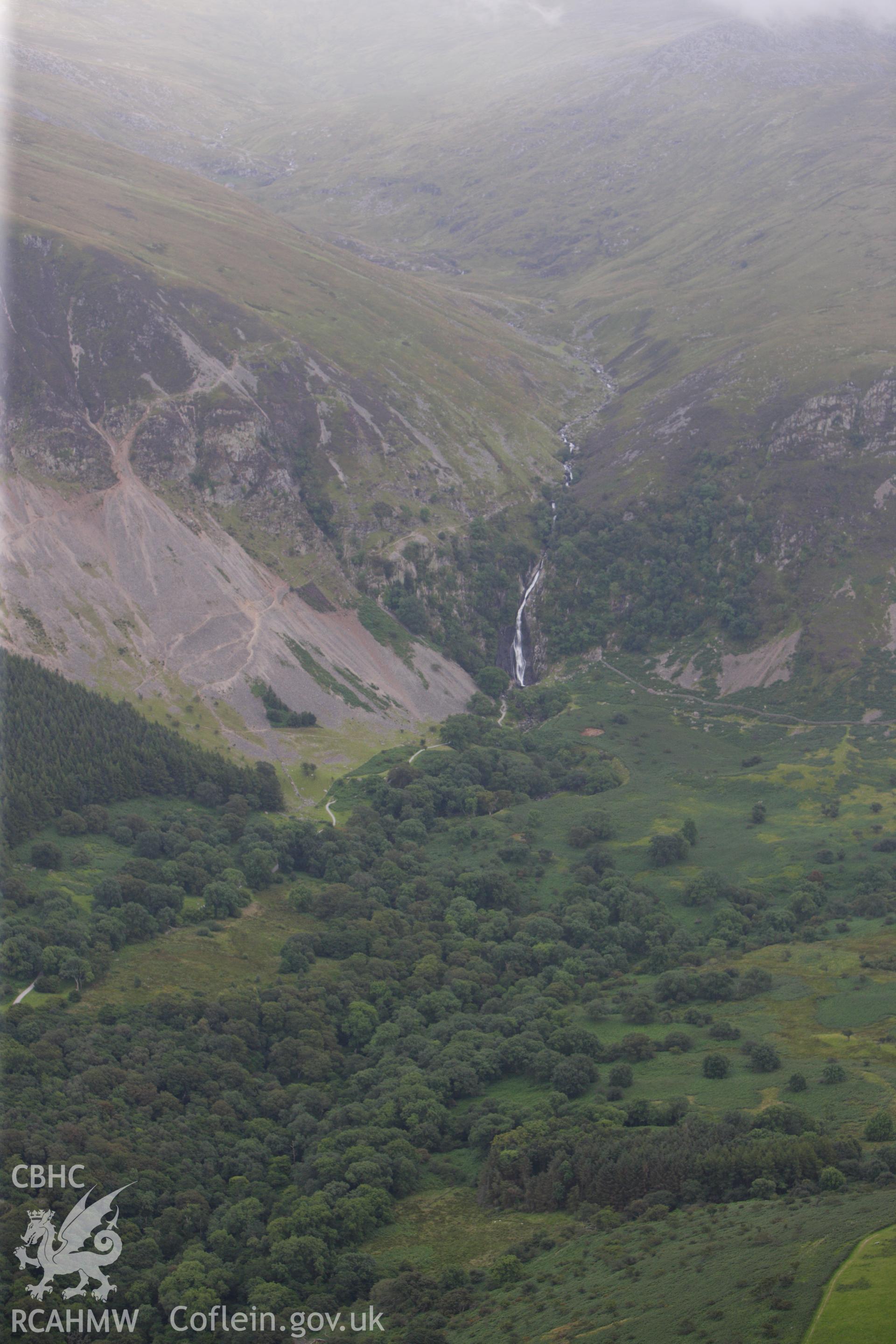 RCAHMW colour oblique aerial photograph of Coedydd Aber National Nature Reserve and Aber Falls. Taken on 06 August 2009 by Toby Driver
