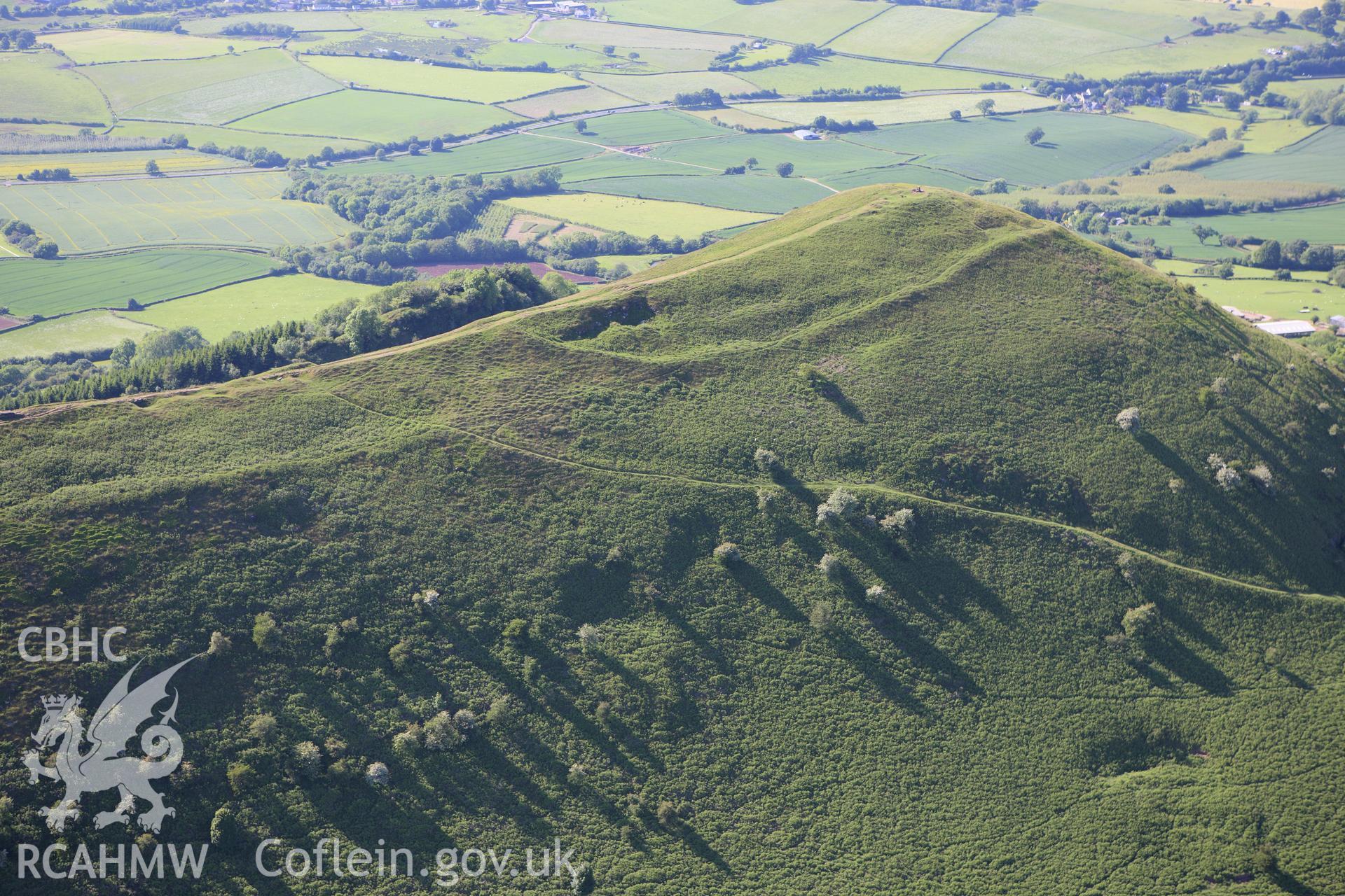 RCAHMW colour oblique aerial photograph of Skirrid Fawr Summit Enclosure. Taken on 11 June 2009 by Toby Driver
