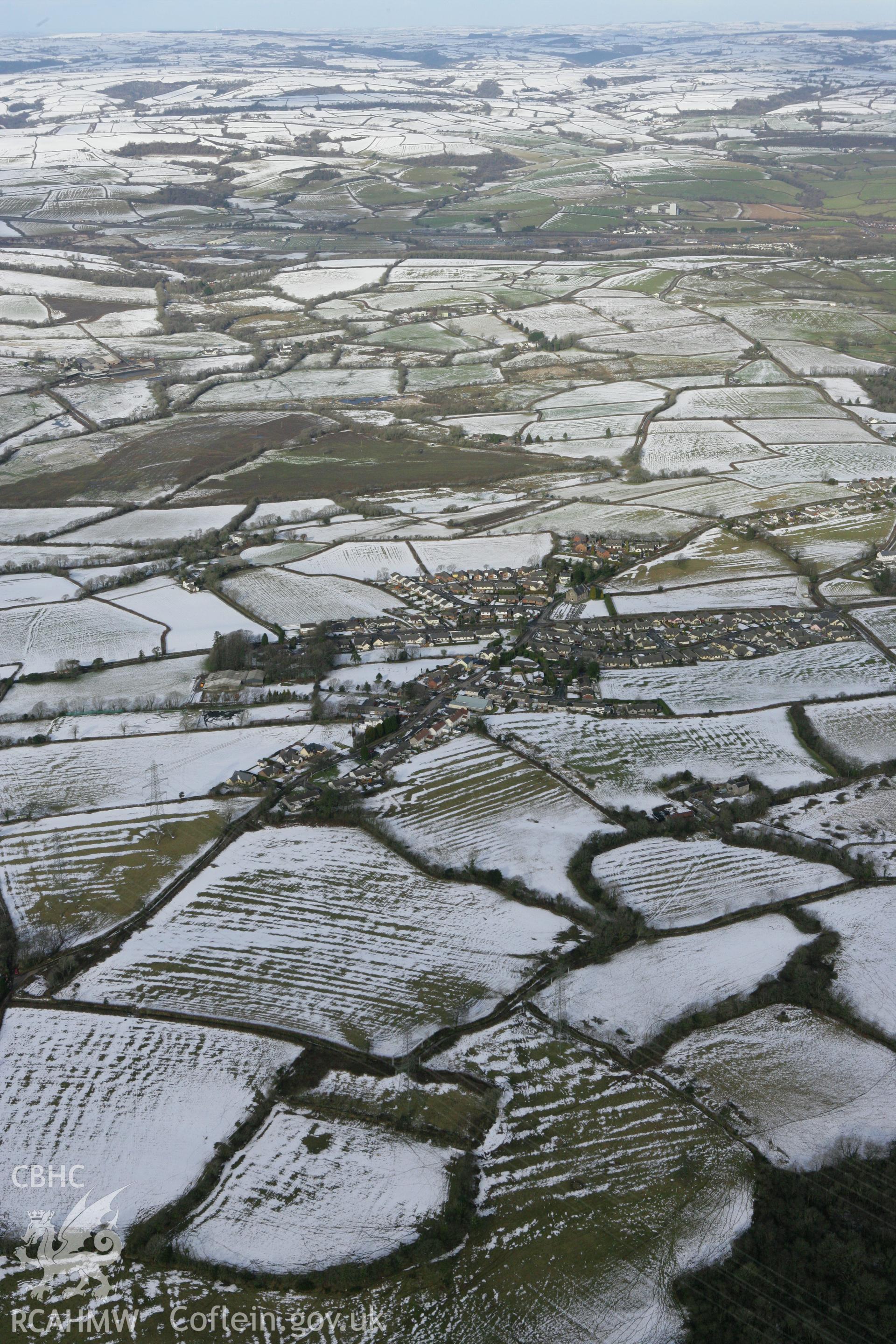 RCAHMW colour oblique photograph of Llangain village. Taken by Toby Driver on 06/02/2009.