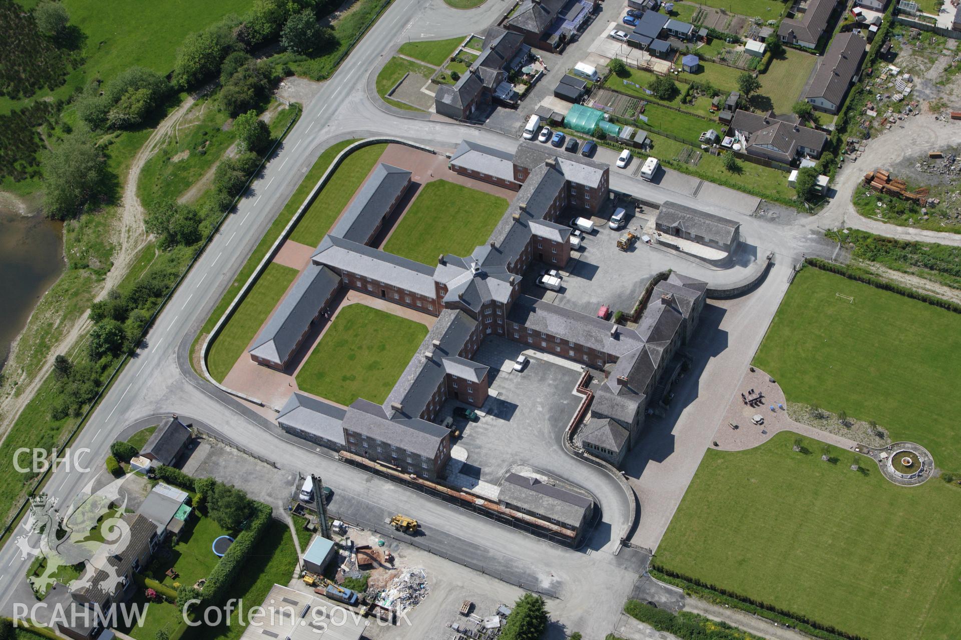 RCAHMW colour oblique aerial photograph of the Union Workhouse, Caersws. Taken on 02 June 2009 by Toby Driver