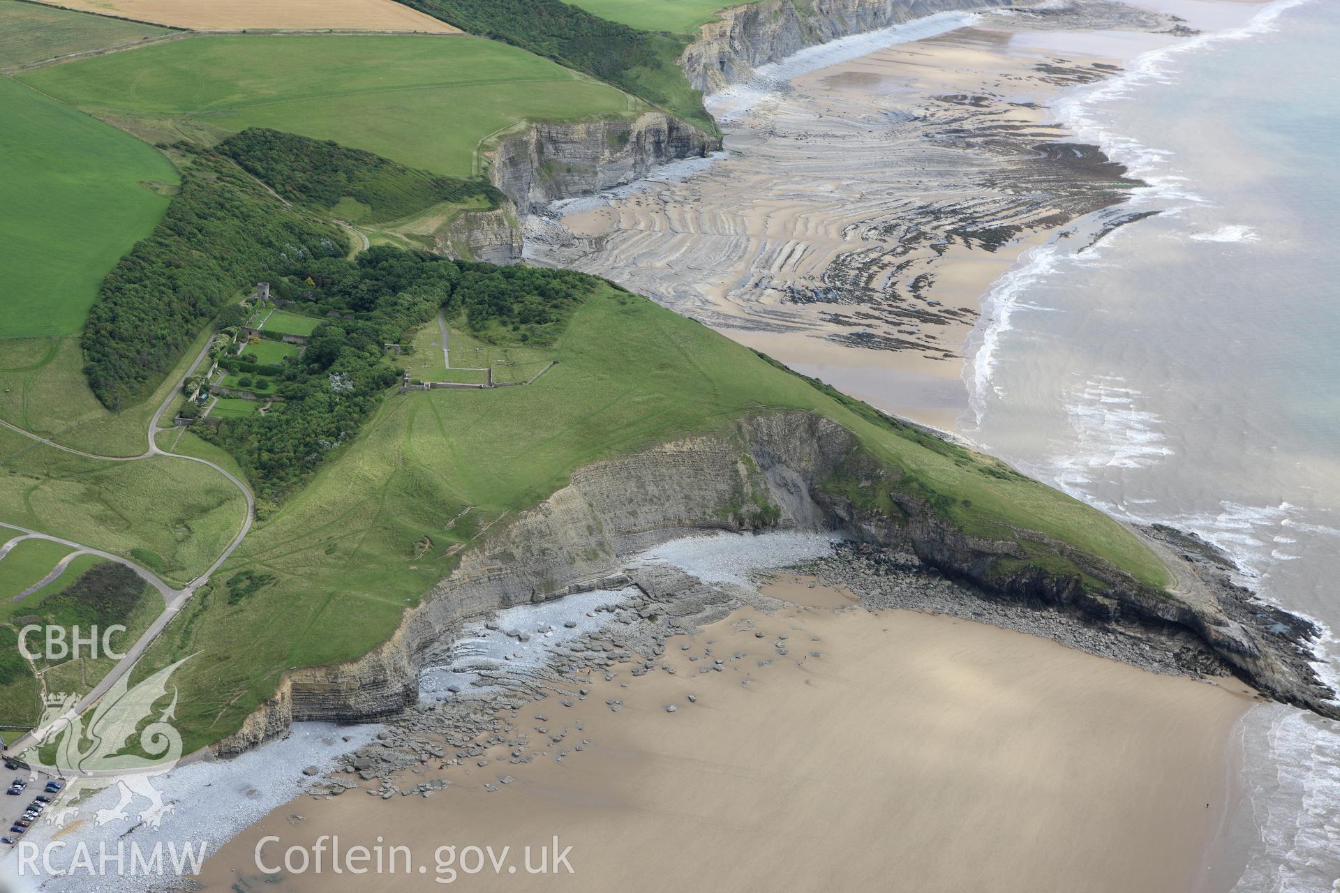 RCAHMW colour oblique aerial photograph of Dunraven Hillfort. Taken on 09 July 2009 by Toby Driver