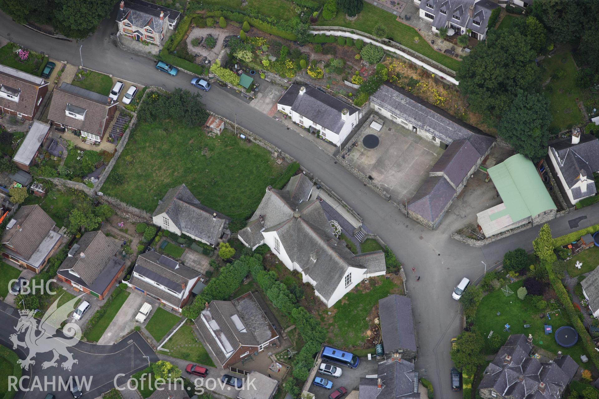 RCAHMW colour oblique aerial photograph of Church Institute, Park Road, Llanfairfechan. Taken on 06 August 2009 by Toby Driver