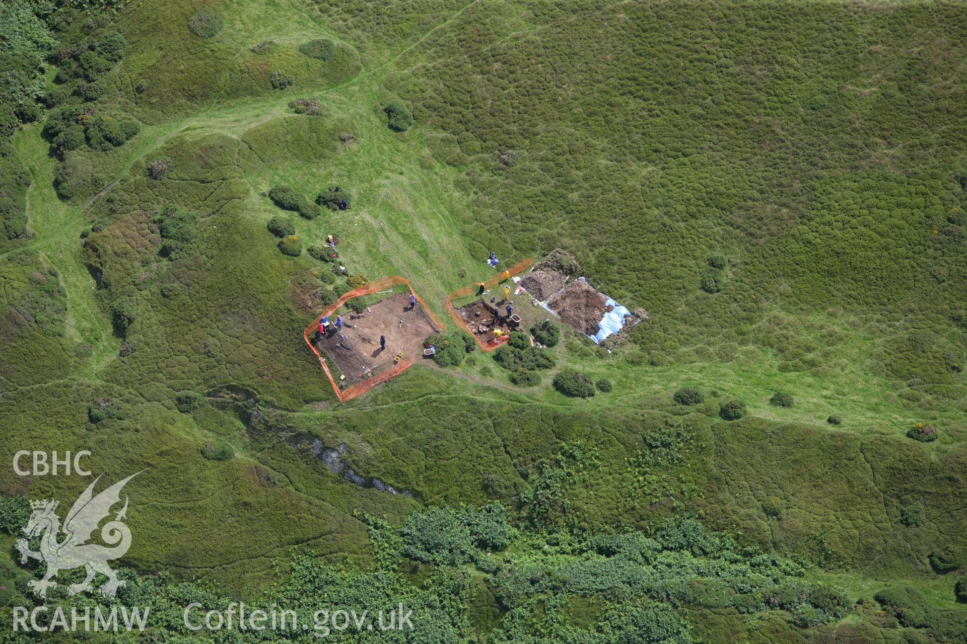 RCAHMW colour oblique aerial photograph of Moel-y-Gaer Hillfort, Llanbedr, with Bangor University excavations. Taken on 30 July 2009 by Toby Driver