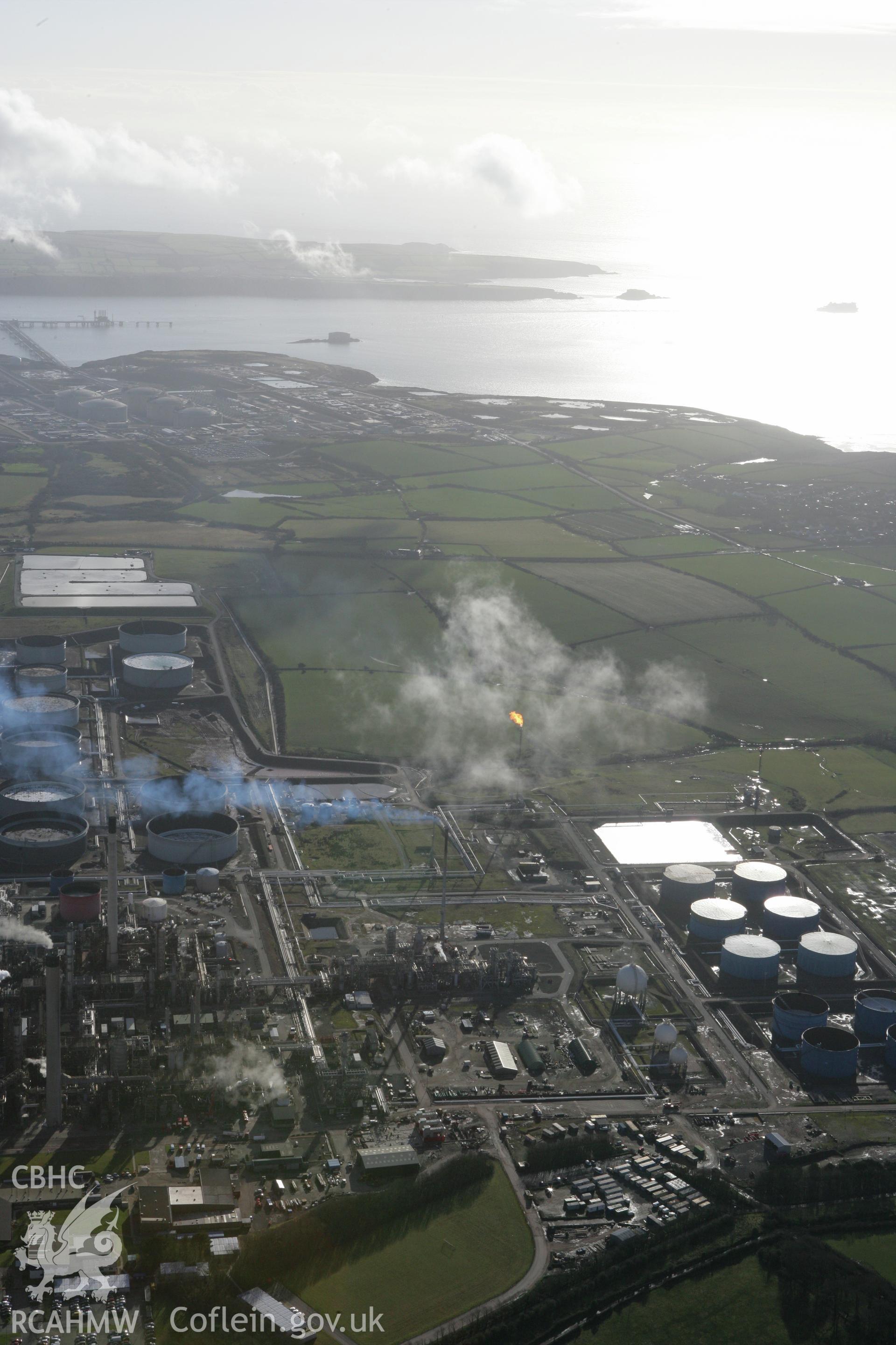 RCAHMW colour oblique photograph of Amoco Oil Refinery, Milford Haven. Taken by Toby Driver on 11/02/2009.