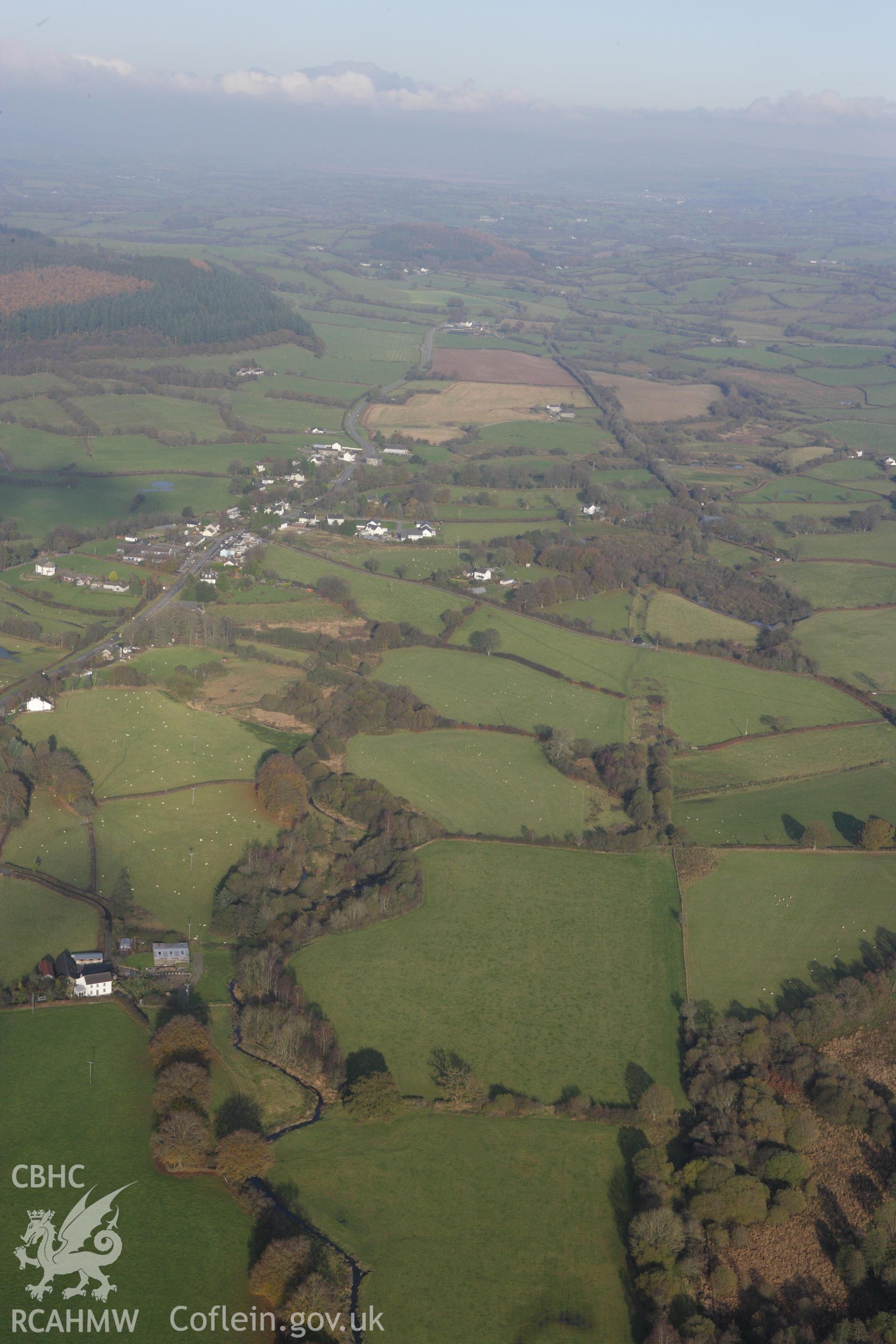 RCAHMW colour oblique aerial photograph of Llangybi viewed from the south-west. Taken on 09 November 2009 by Toby Driver