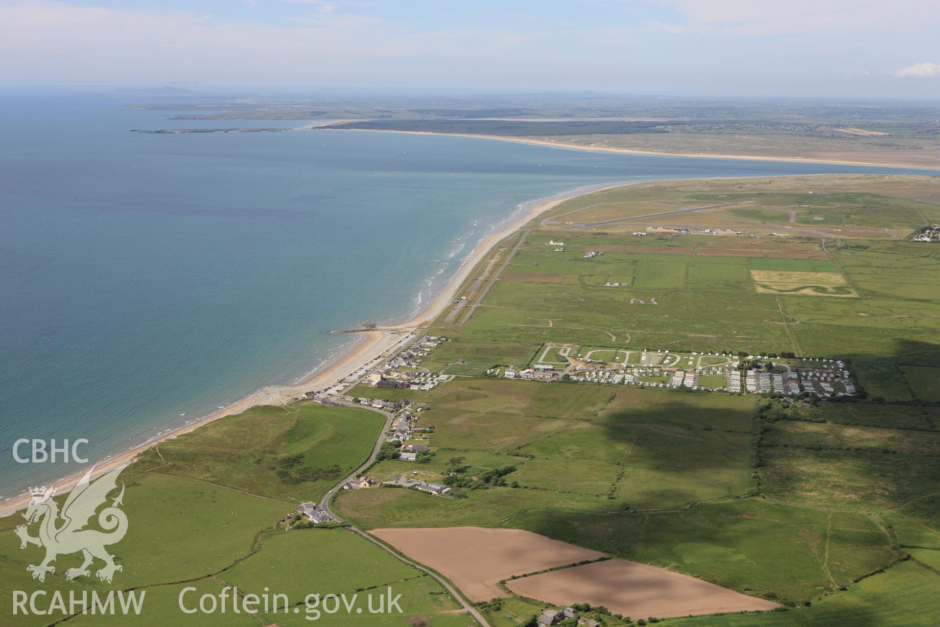 RCAHMW colour oblique aerial photograph of the landscape around Dinas Dinlle Hillfort, Llandwrog. Taken on 16 June 2009 by Toby Driver