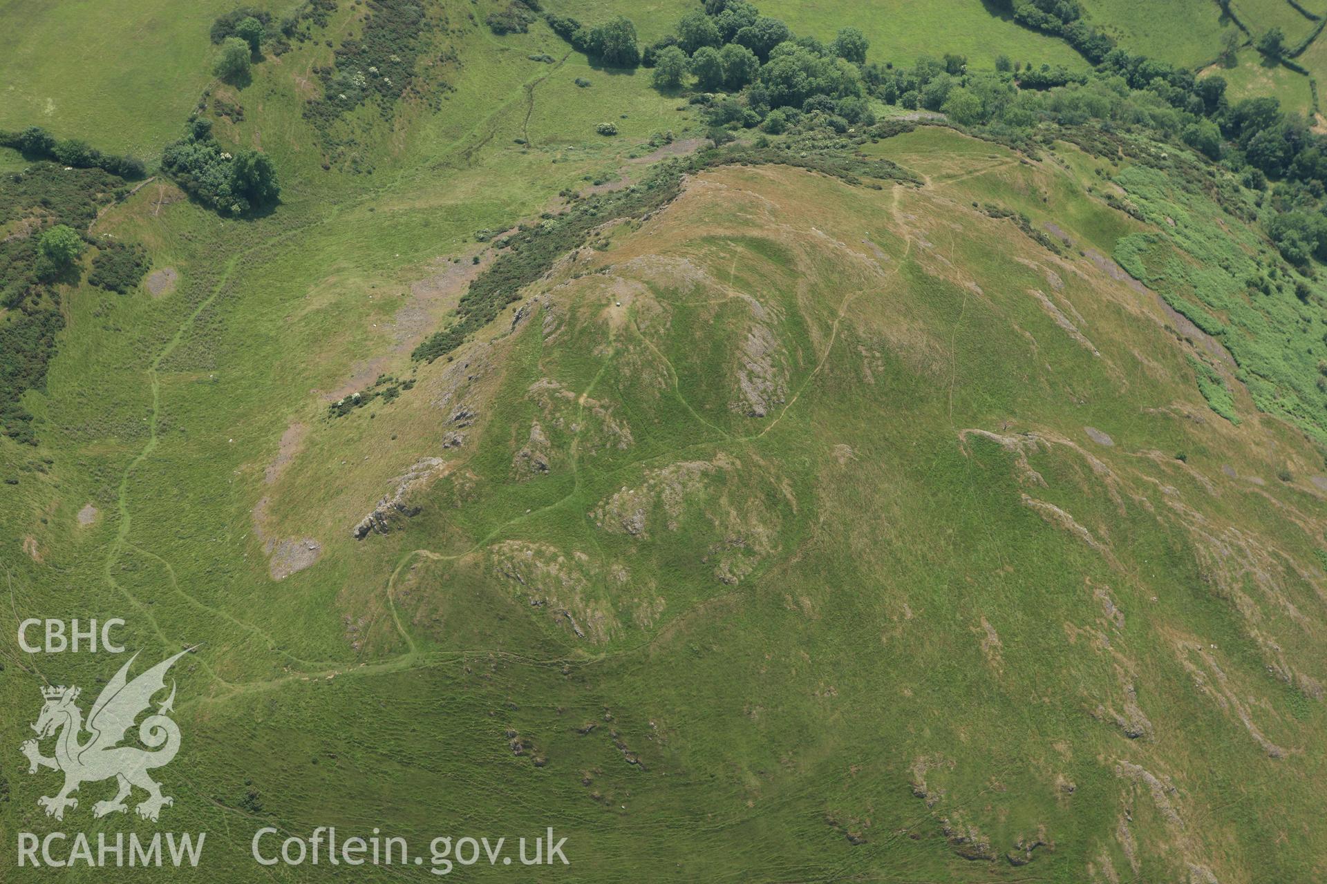 RCAHMW colour oblique aerial photograph of Roundton Enclosure. Taken on 29 June 2009 by Toby Driver