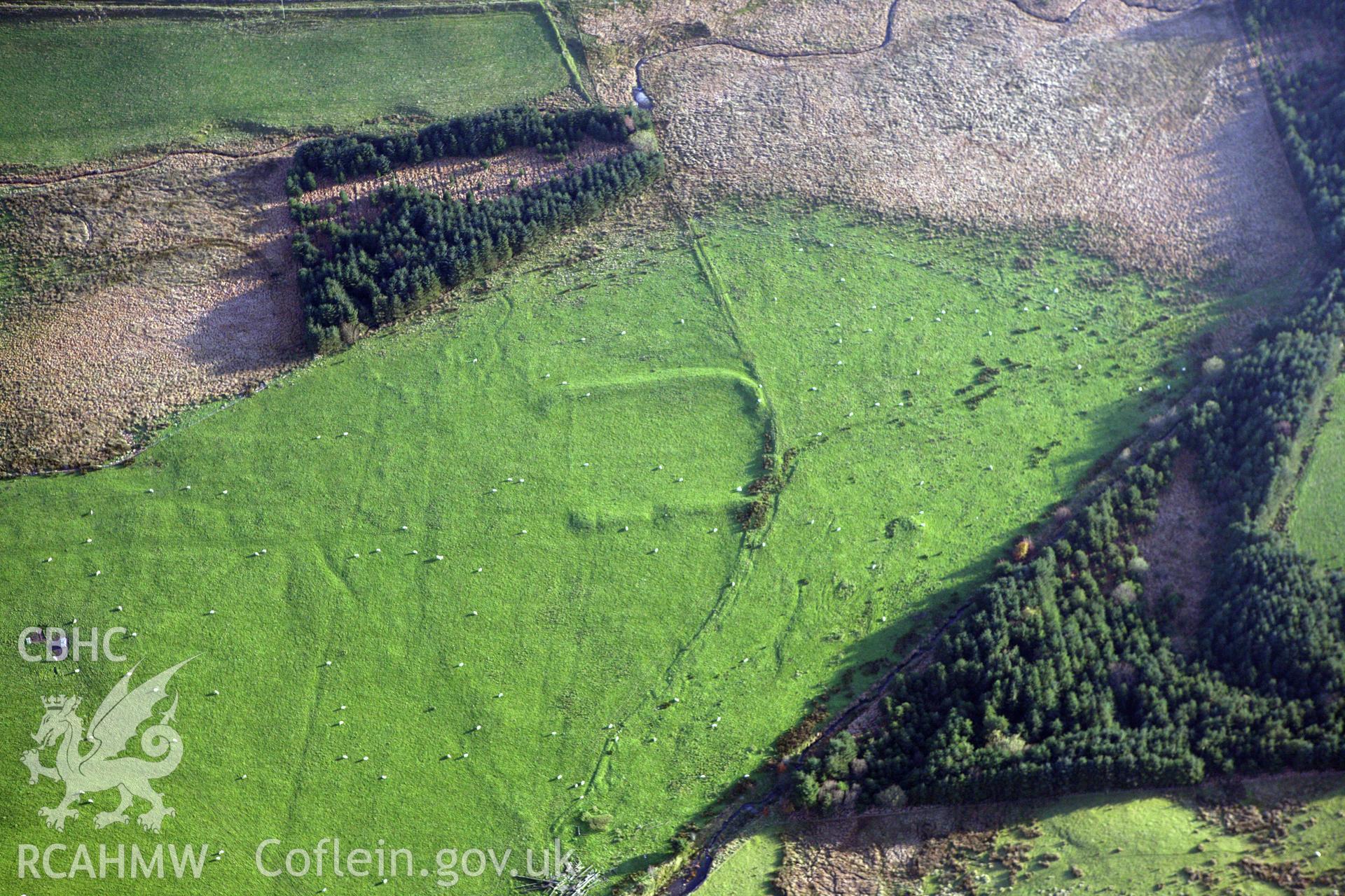 RCAHMW colour oblique aerial photograph of Llys Arthur earthwork. Taken on 09 November 2009 by Toby Driver