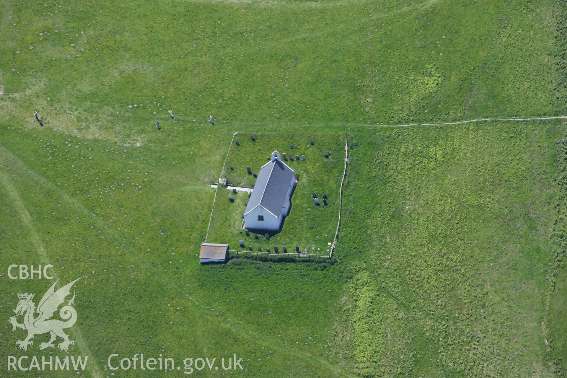 RCAHMW colour oblique aerial photograph of Holy Cross Church, Mwnt Verwig. Taken on 01 June 2009 by Toby Driver