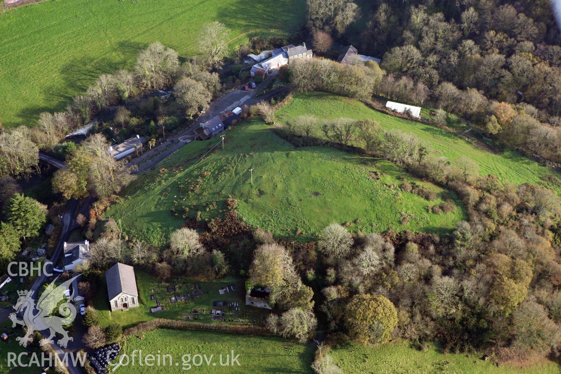 RCAHMW colour oblique aerial photograph of a defended enclosure at Capel Dewi. Taken on 09 November 2009 by Toby Driver