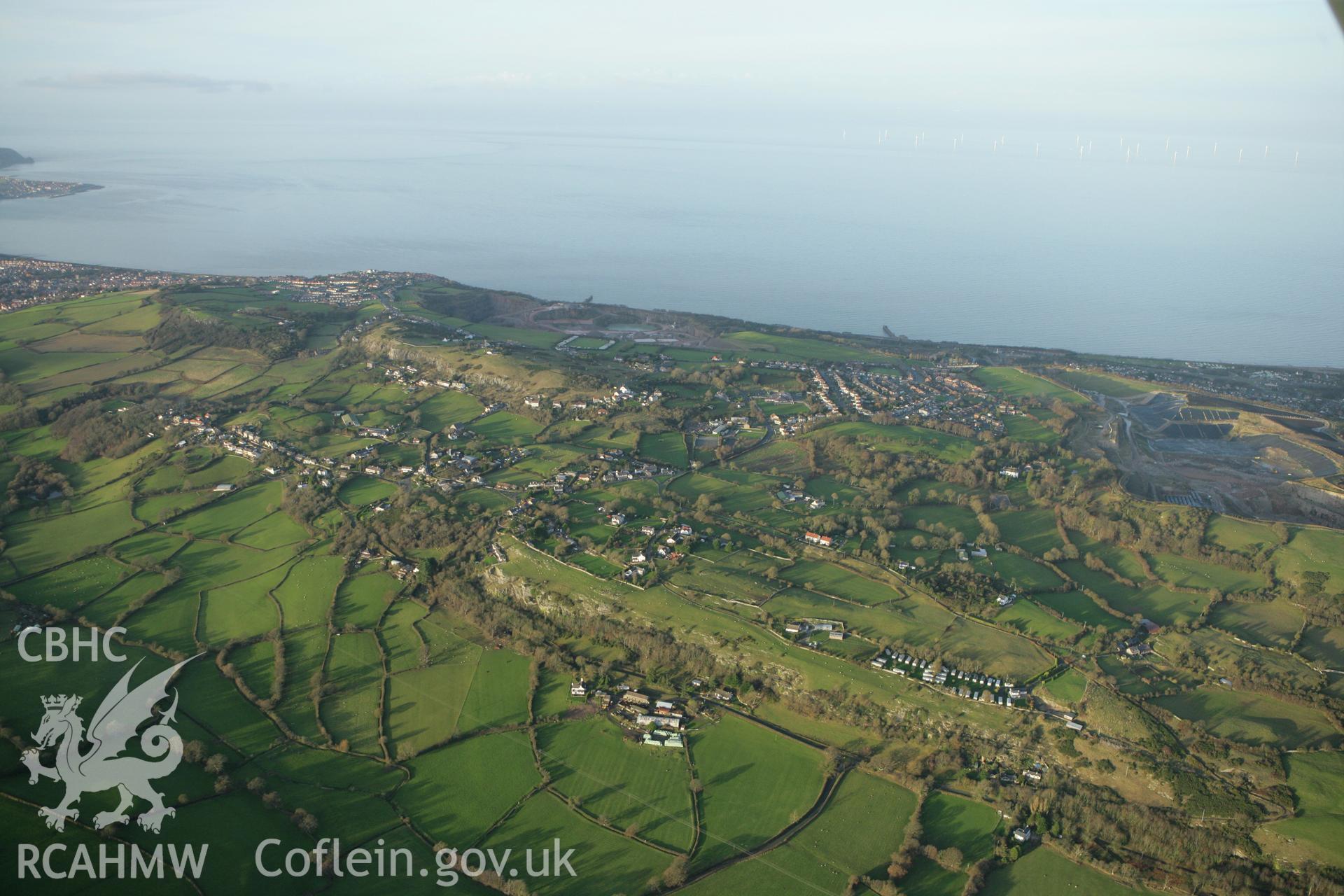 RCAHMW colour oblique aerial photograph of Iandscape of Isallt, Llysfaen and the Mynydd Marian. Taken on 10 December 2009 by Toby Driver