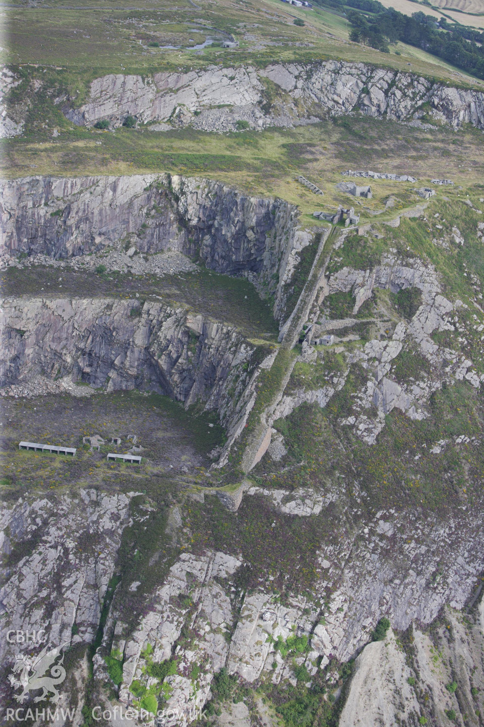 RCAHMW colour oblique aerial photograph of incline at Penmaenmawr Quarry. Taken on 06 August 2009 by Toby Driver