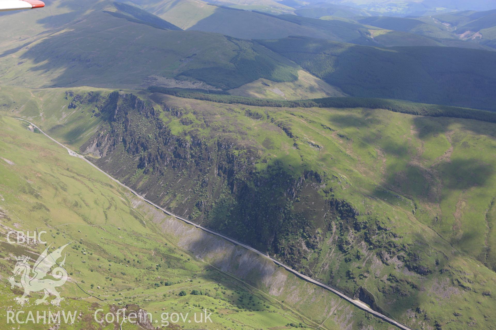 RCAHMW colour oblique aerial photograph of Anti-Tank Blocks and Roadblock, Bwlch Llyn Bach. Taken on 02 June 2009 by Toby Driver