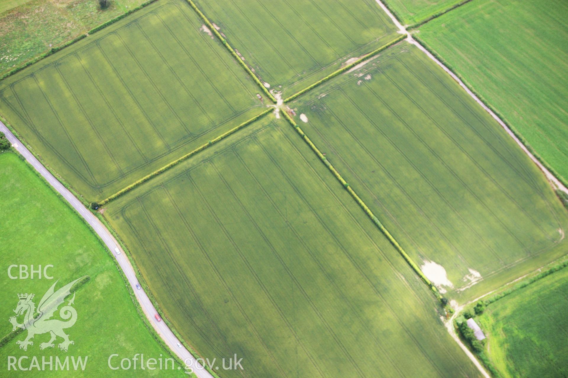 RCAHMW colour oblique aerial photograph of Llancayo Farm Roman Marching Camp Taken on 09 July 2009 by Toby Driver