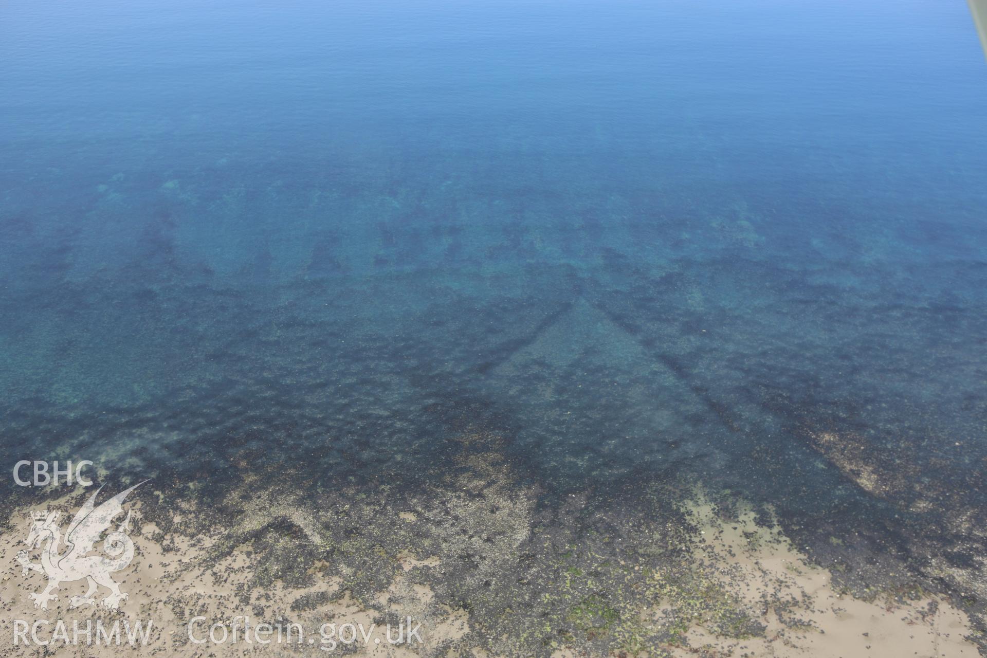 RCAHMW colour oblique aerial photograph of Mynachdy'r-Graig Fish Trap I. Taken on 02 June 2009 by Toby Driver
