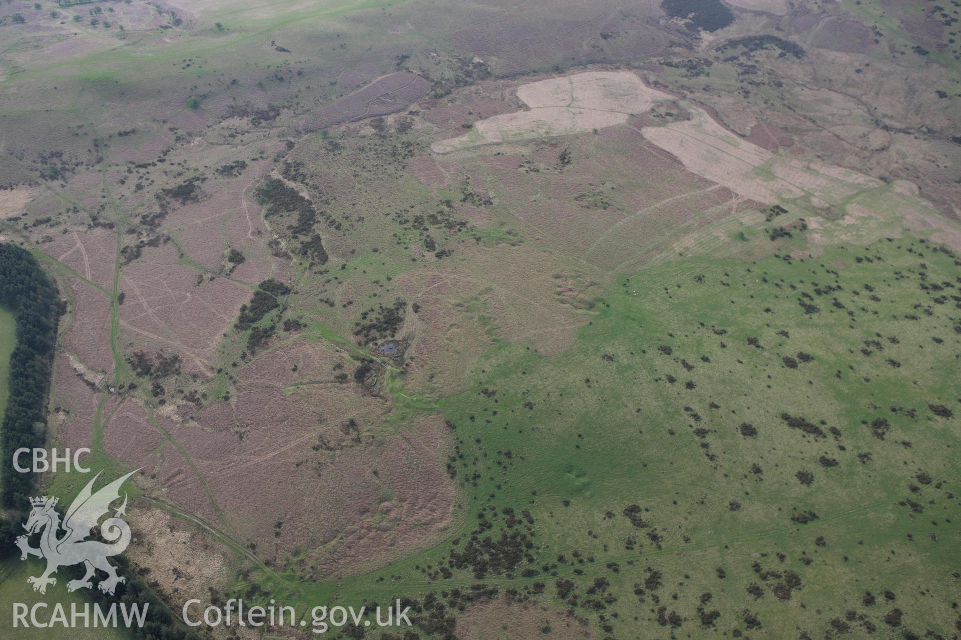 RCAHMW colour oblique aerial photograph of post medieval stone quarries, Quarry Bank. Taken on 21 April 2009 by Toby Driver