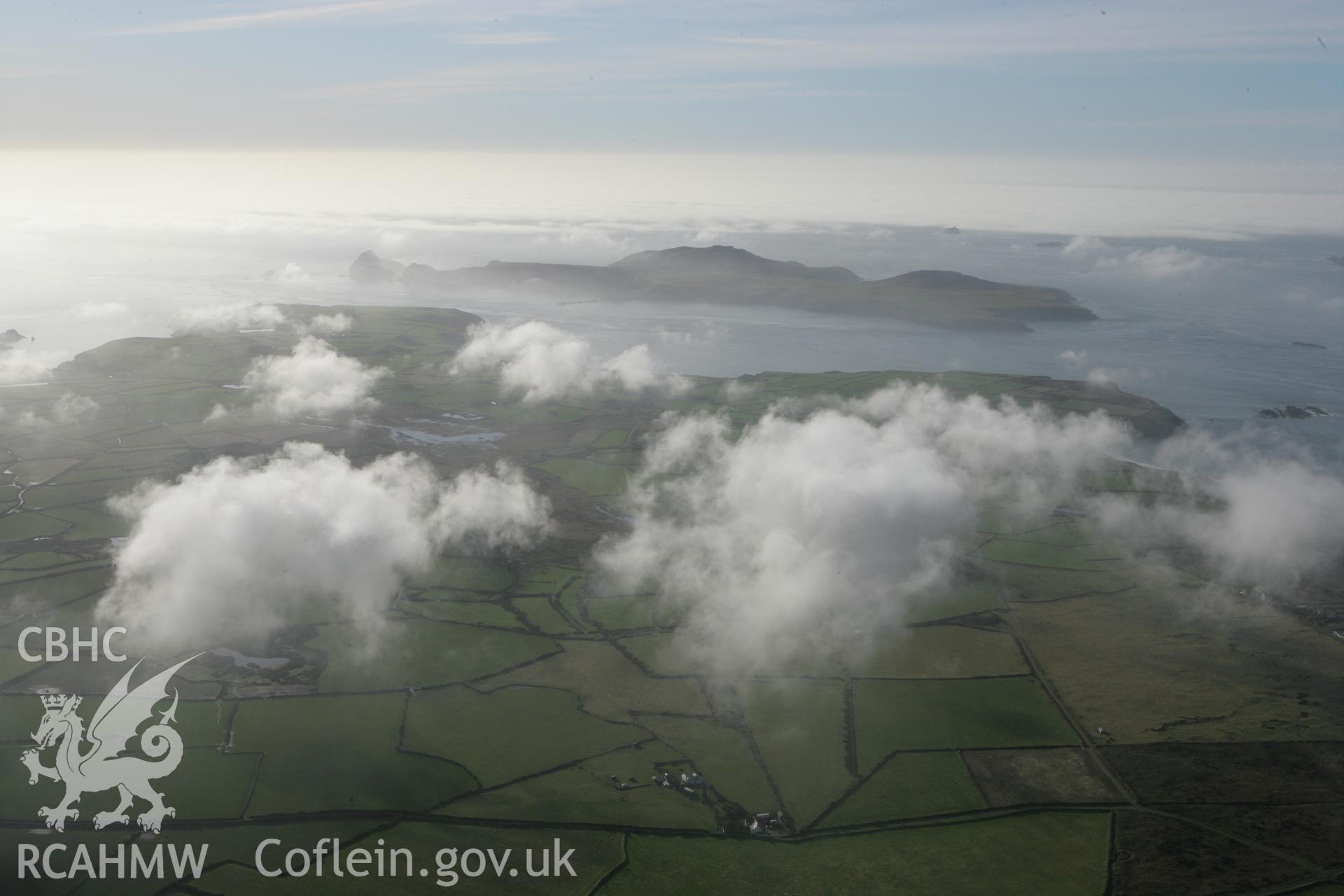 RCAHMW colour oblique aerial photograph of Clegyr Boia and surrounding landscape with cloud. Taken on 28 January 2009 by Toby Driver