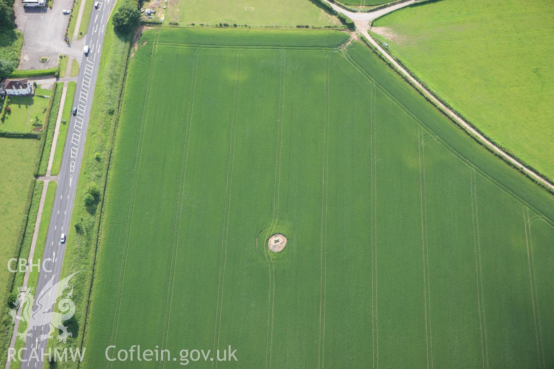 RCAHMW colour oblique aerial photograph of Five Lanes Round Barrow A. Taken on 11 June 2009 by Toby Driver